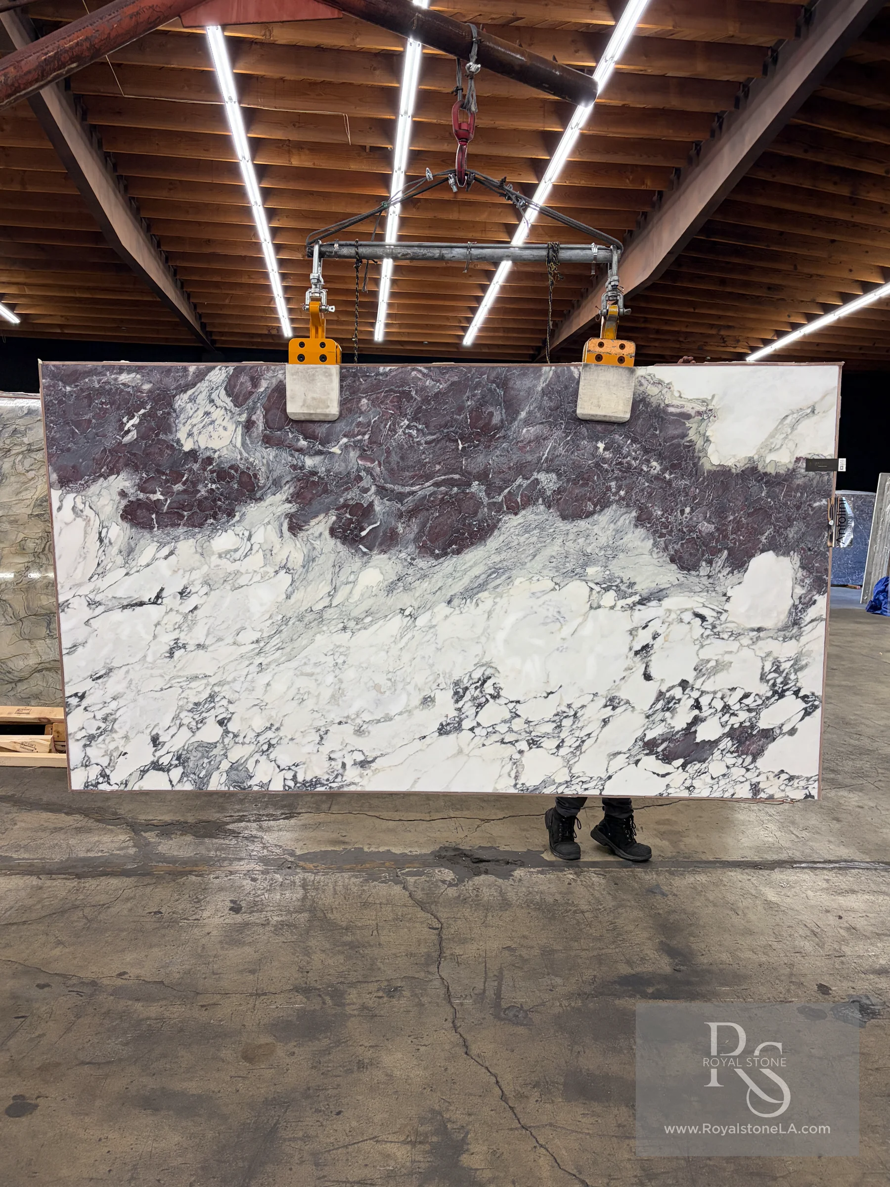 2cm Antolini Breccia Capraia Wow YG954 honed marble slab, 71 by 127 inches, with a white field and violet, burgundy, and gray breccia movement at the Royal Stone warehouse