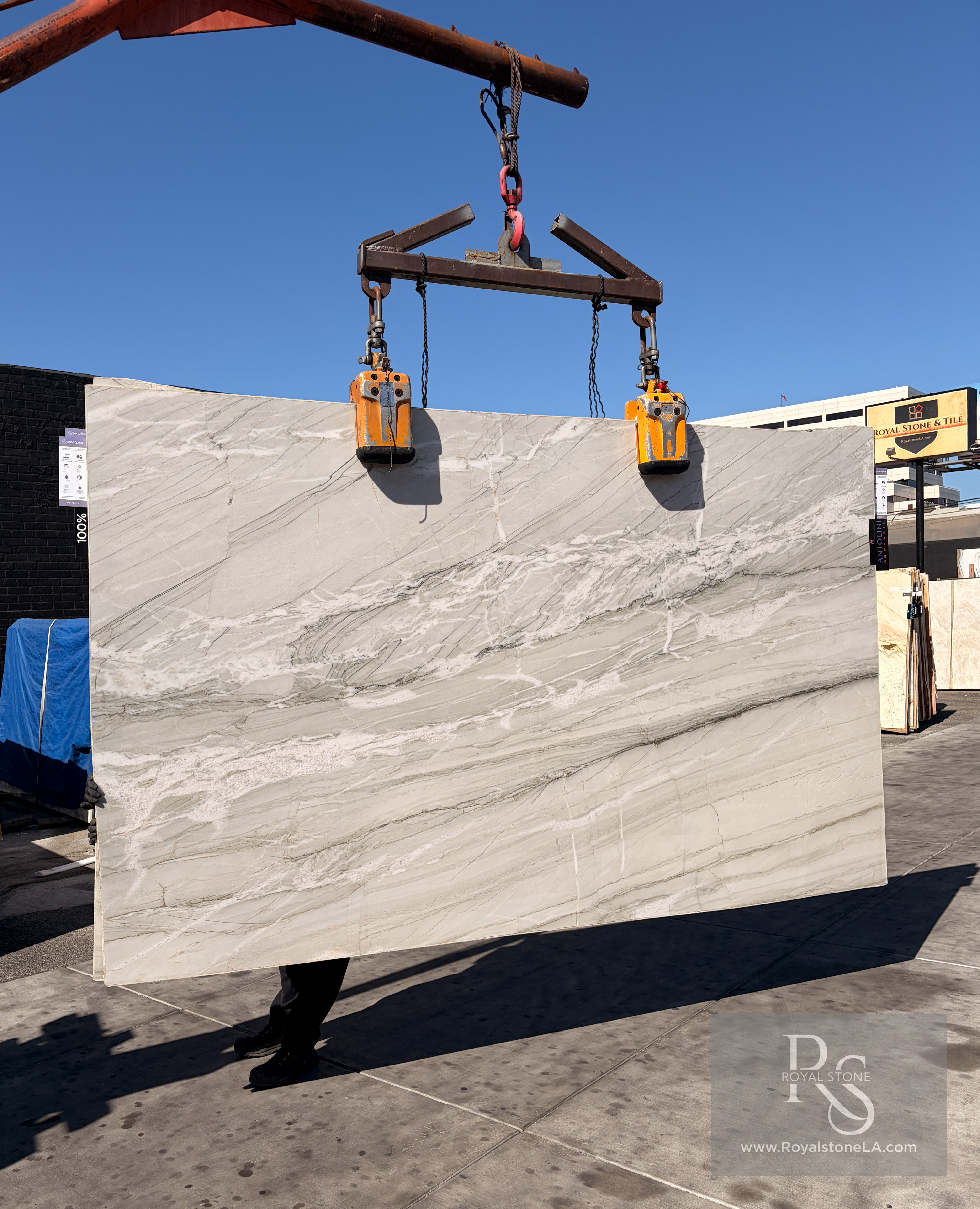 Additional view of the Antolini Gabana Nuage AO554 polished quartzite slab, 79 by 127 inches, being handled at the Royal Stone yard