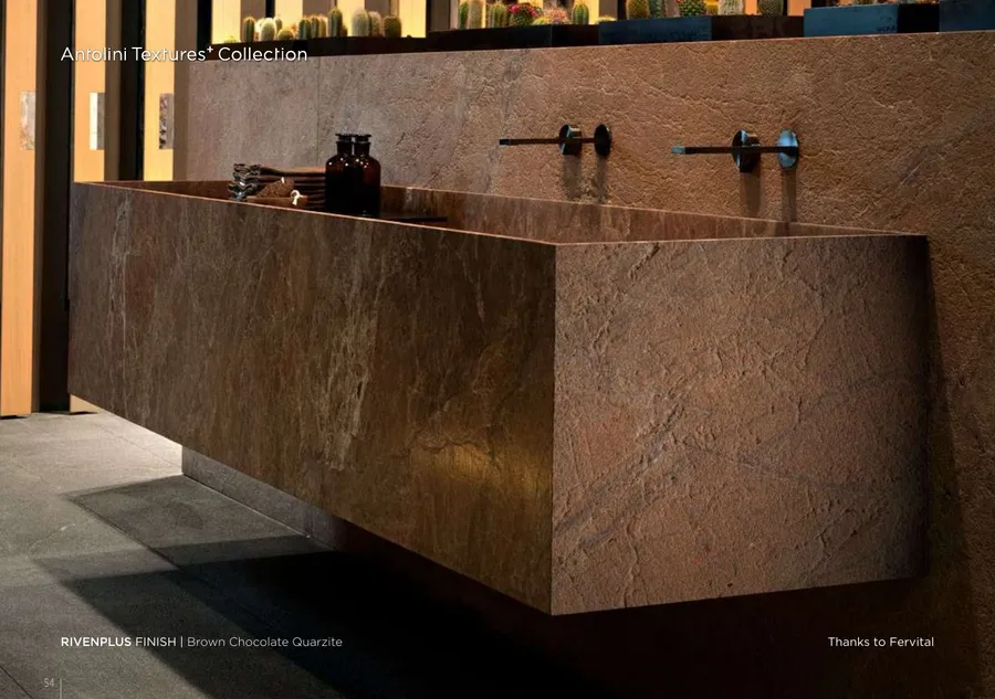 Antolini Brown Chocolate Quarzite in Rivenplus Finish, warm brown field with iron passages, freestanding vanity install