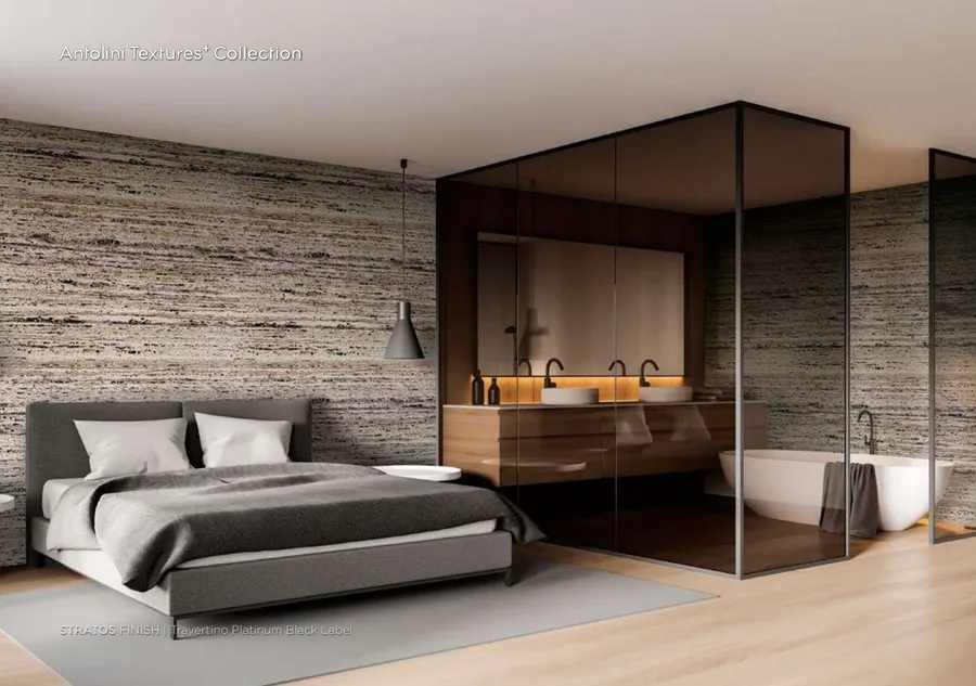Antolini Travertino Platinum Black Label travertine in Stratos Finish, layered grey-cream-iron field, primary bedroom feature wall