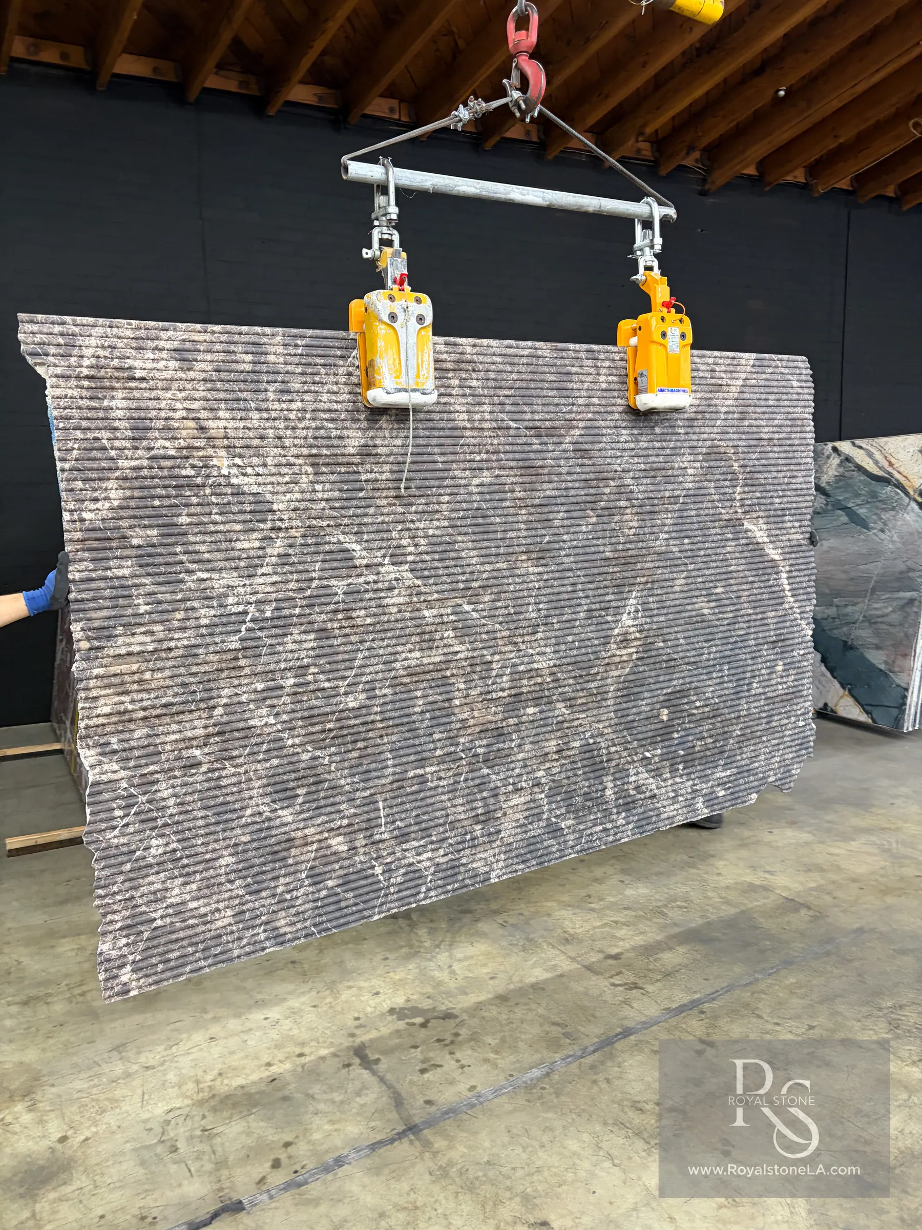 2cm Antolini Dark Emperador Henraux marble slab, 69 by 110 inches, finished in the Flute Texture line — a fine vertical relief cut across the panel with the white calcite veins carried up the ridges of the flutes