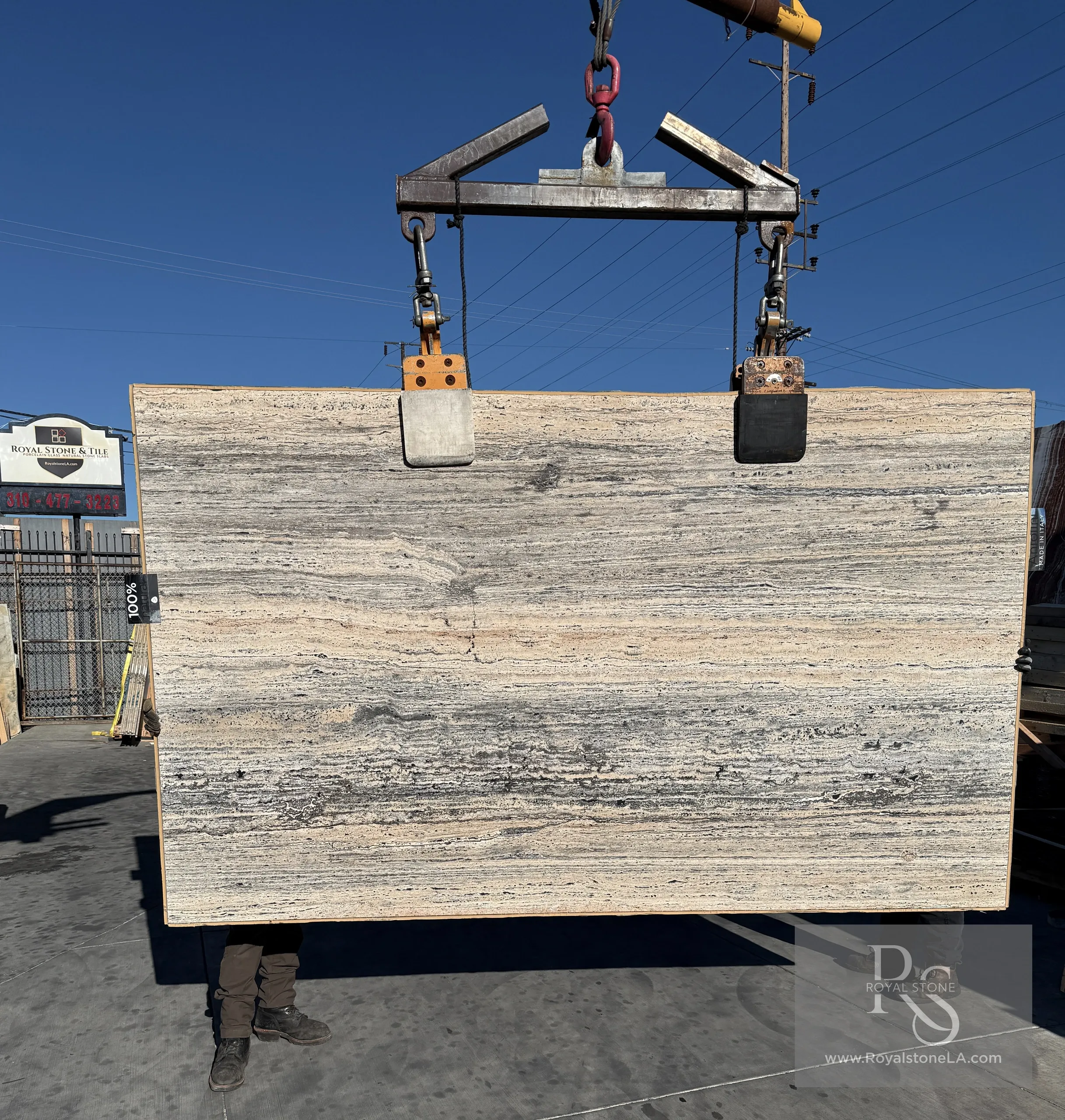 2cm Antolini Black Label Platinum Travertine with vein cut leather finish, 66 inches by 110 inches