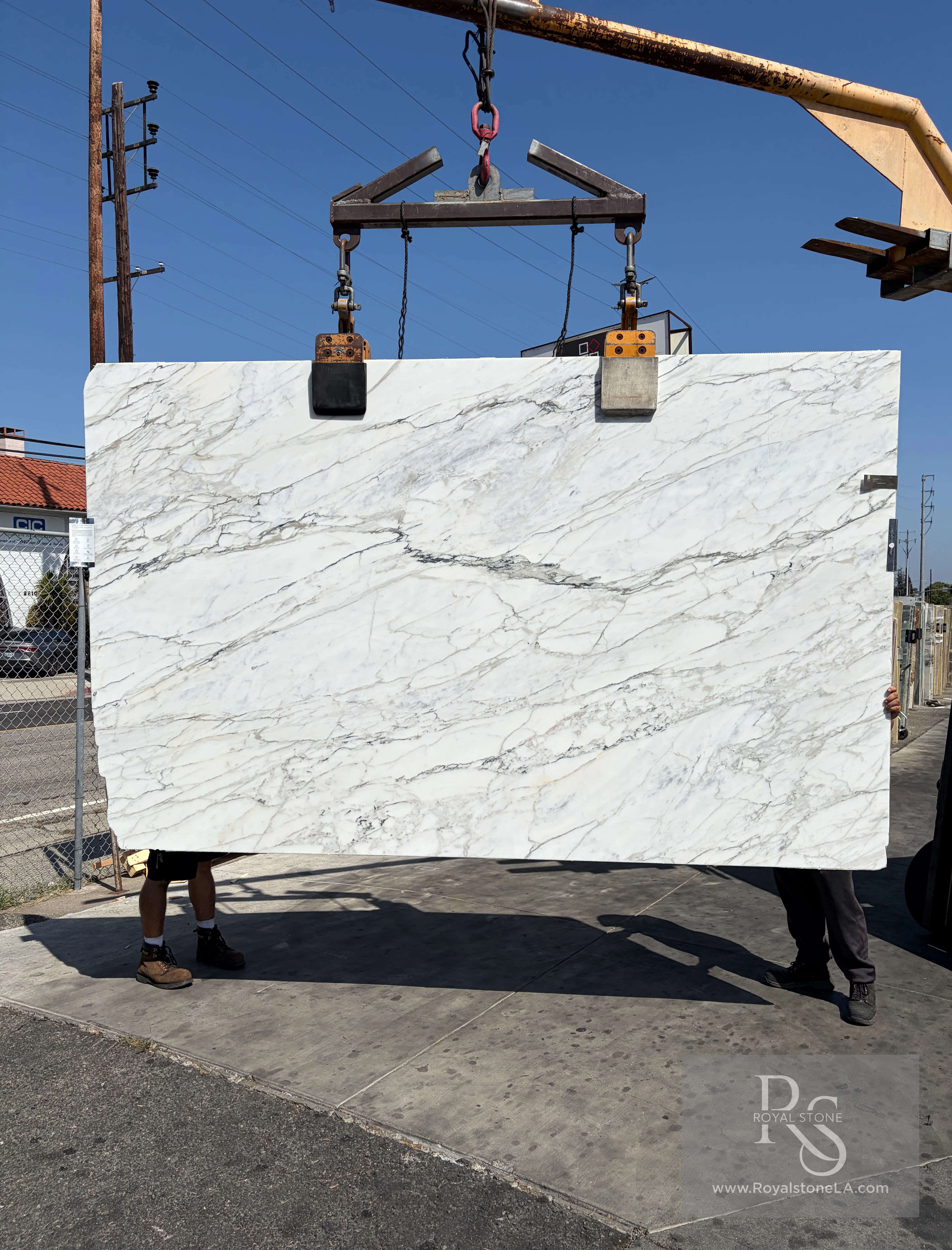 Antolini Calacatta Borghini Soft Vein EI292 marble slab with honed finish at Royal Stone Los Angeles, 78 inch by 126 inch, bright field with quiet grey movement