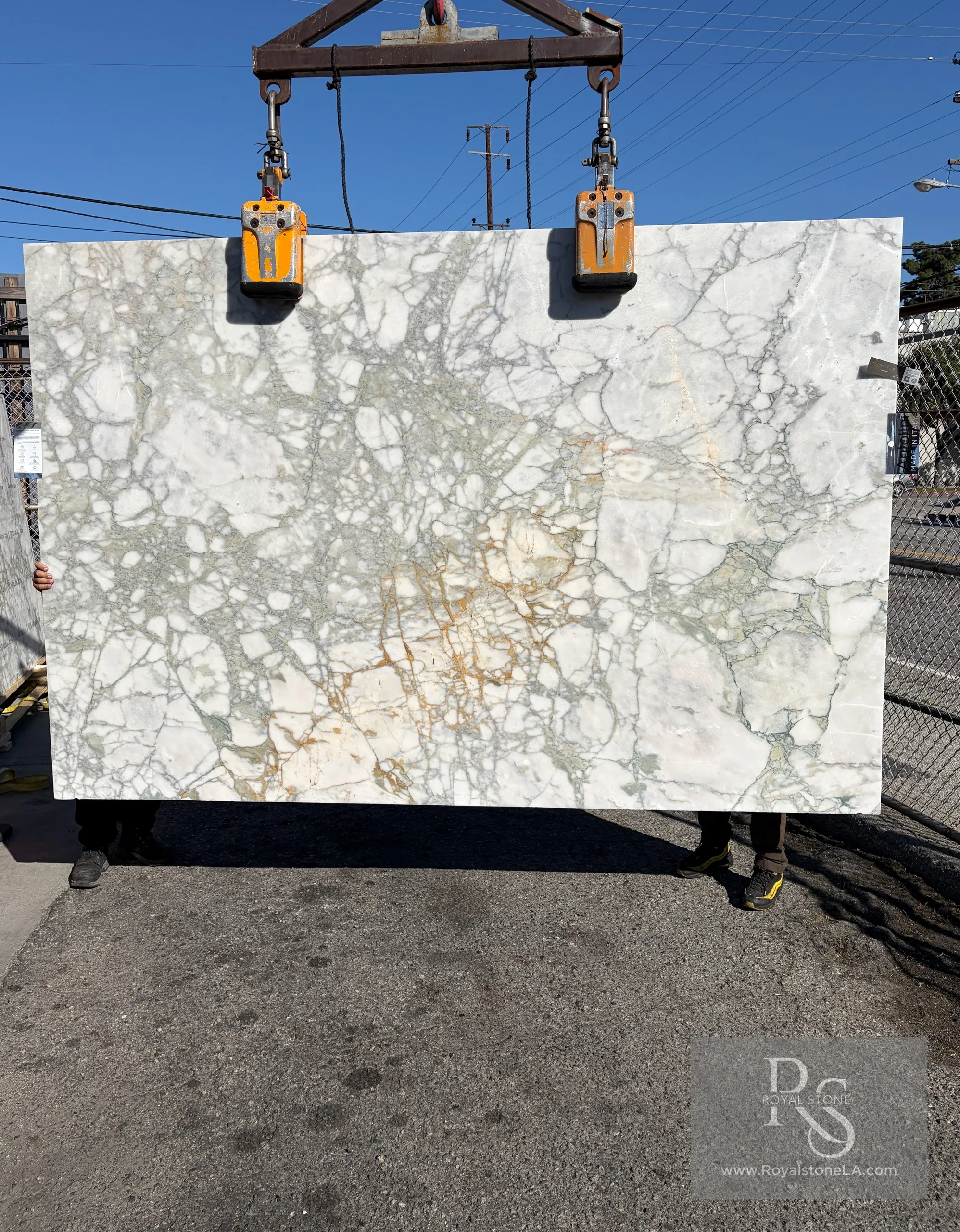 Antolini Calacatta Monet Verde honed marble slab with soft white, pale green mineral, and golden crystalline structures
