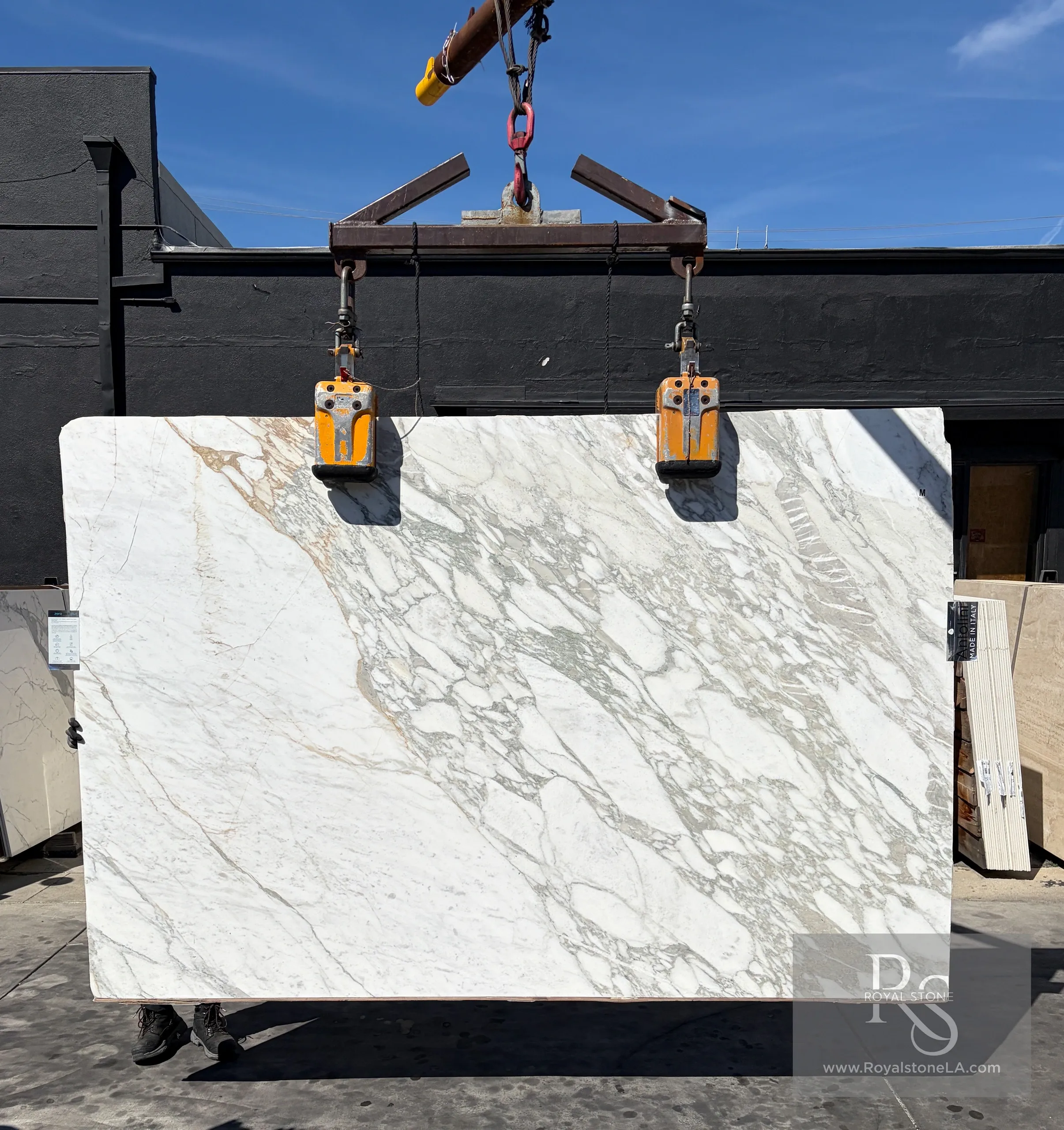 Antolini Calacatta Taupe Monet Extra marble slab with soft white base, taupe ribbons, and gray webbing in honed finish