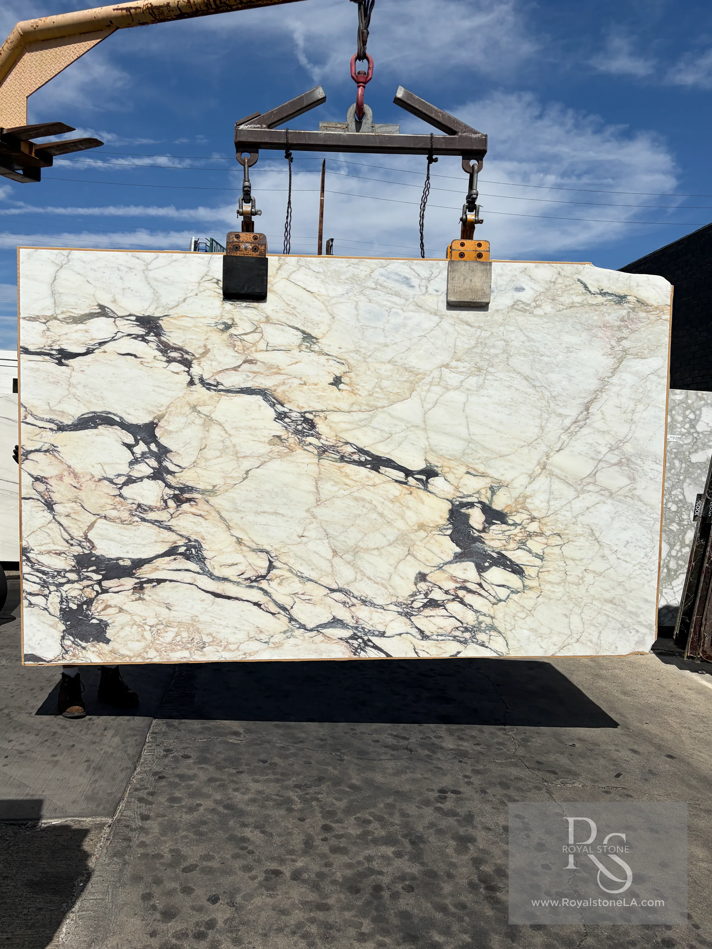 2cm Antolini Calacatta Viola Top EG350 honed marble slab, 77 by 126 inches, bright white ground with dramatic black-violet, gray, and warm mineral movement, at the Royal Stone yard in Los Angeles