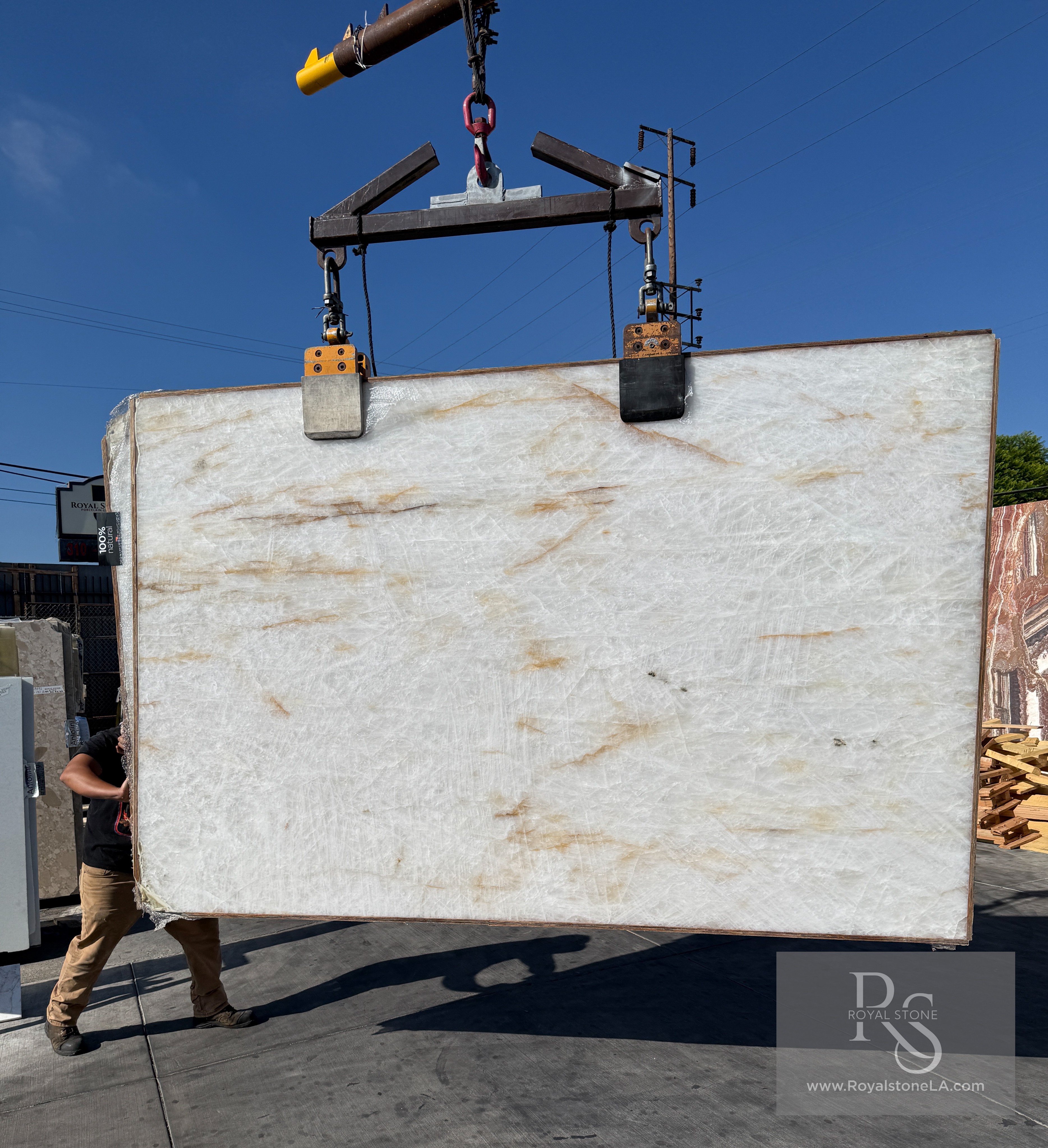 Antolini Cristallo Bianco Lumix A0375 polished quartzite slab at Royal Stone, crystalline white field with soft amber drift