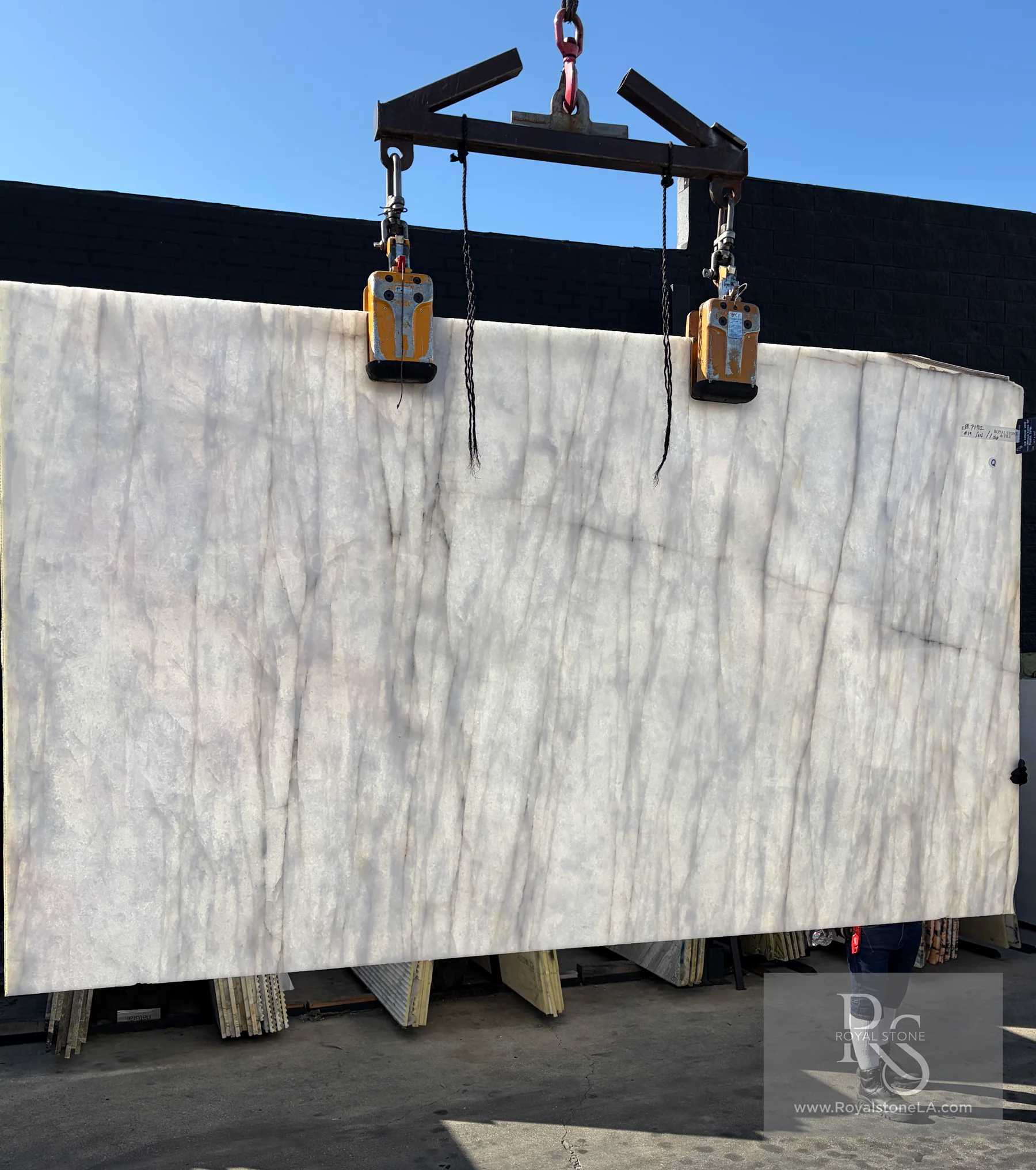 Backlit 2cm Antolini White Cristallo Bianco Top YG756 polished quartzite slab showing its luminous crystalline structure
