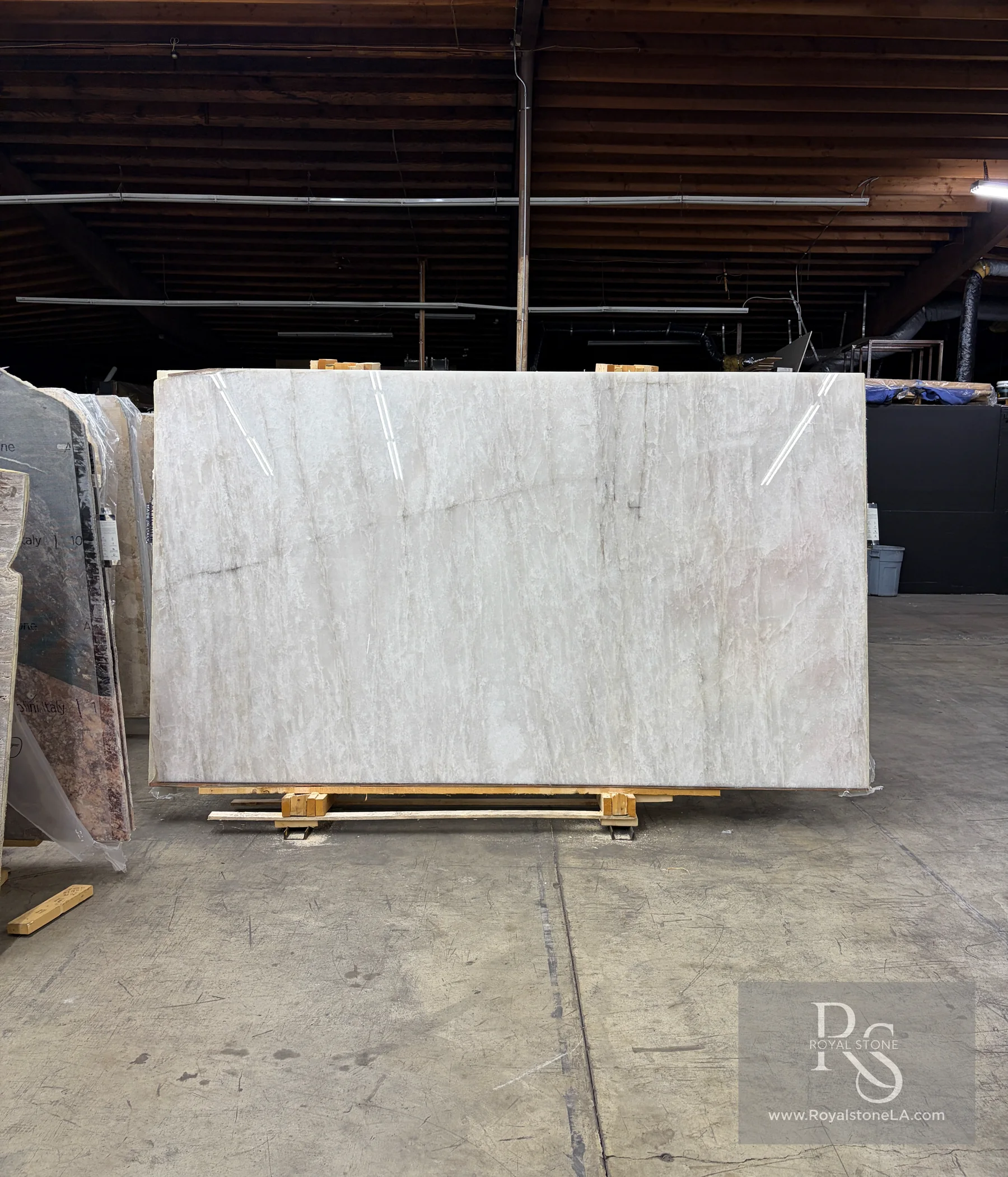 Antolini White Cristallo Bianco Top YG756 polished quartzite slab, 78 by 135 inches, photographed in standard warehouse light