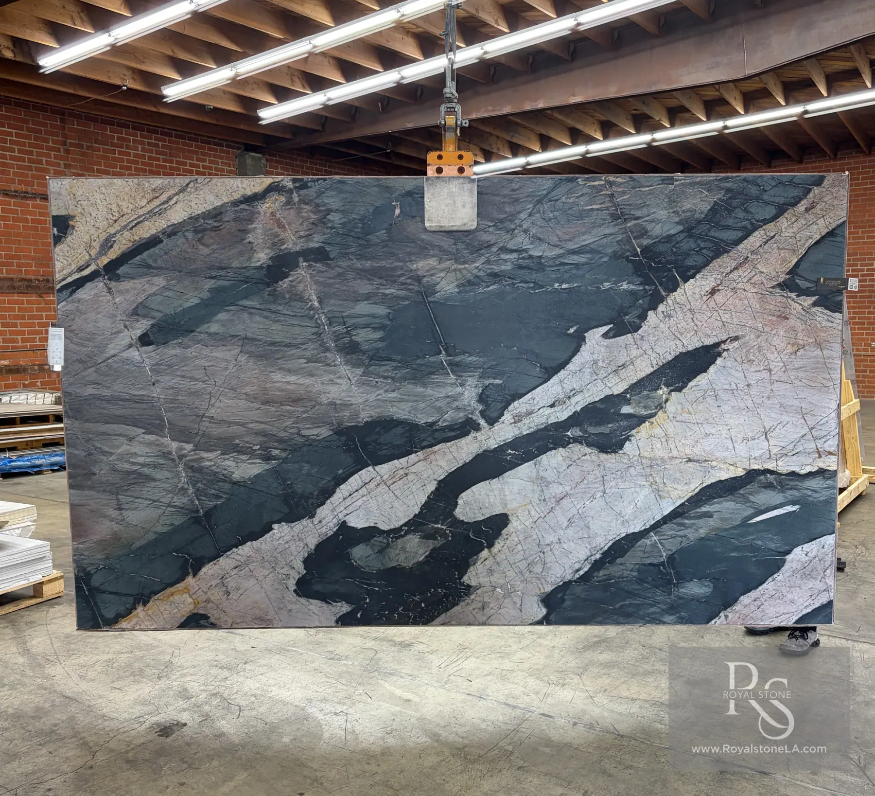 Antolini Green Savage quartzite slab YG674 honed at Royal Stone Los Angeles, matte slate and forest green field with ivory chalk veins and rose-amber accents, 78 by 129 inches