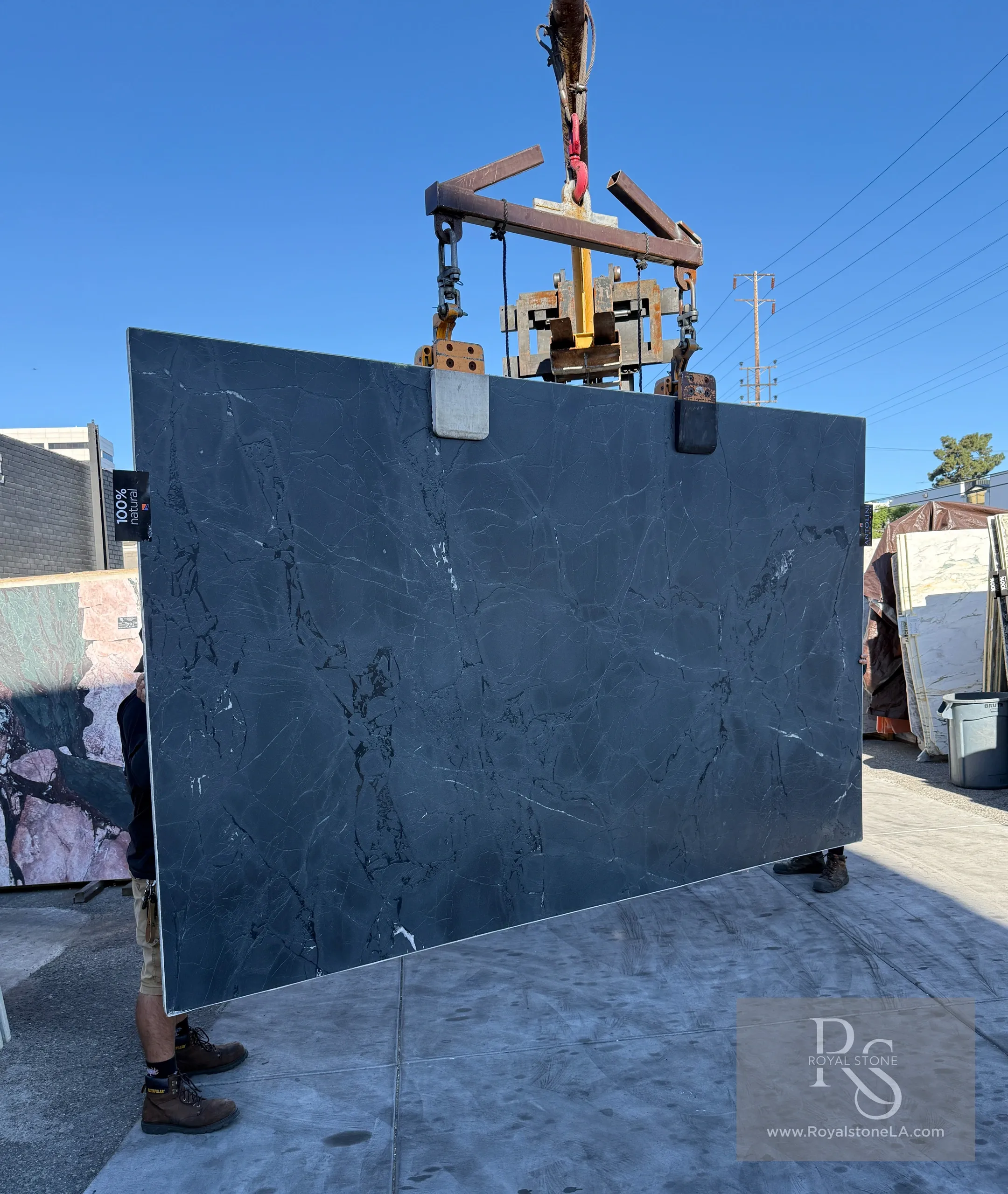 Antolini Negresco leathered finish quartzite slab, 77 x 128 inches, showing deep charcoal surface with subtle veining and matte tactile texture