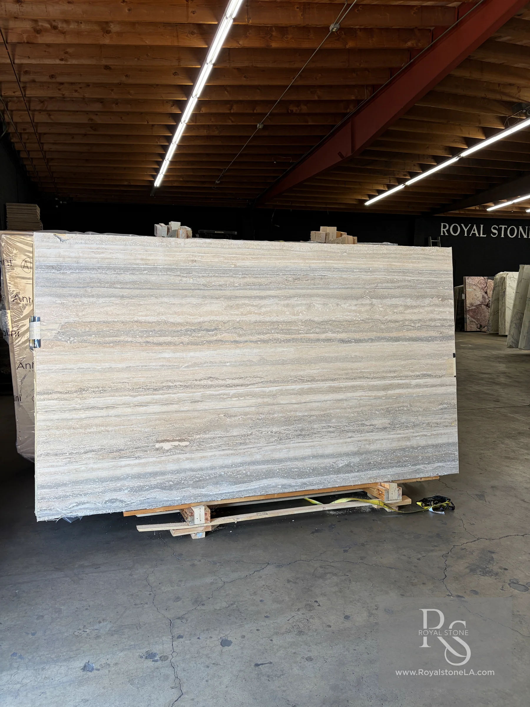 Antolini Ocean Blue Silver Original Travertine EG365 filled and honed slab in the Royal Stone warehouse, 78 by 126 inches