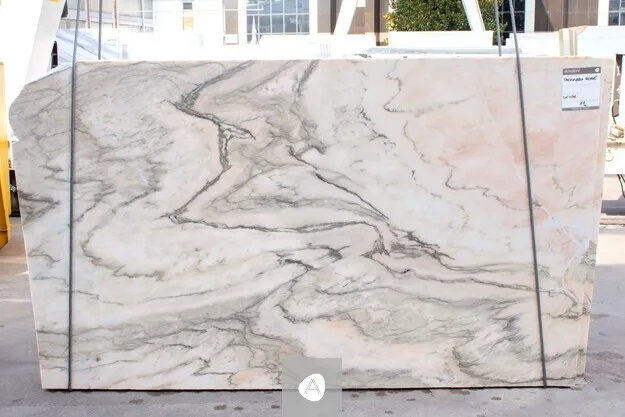 Antolini Paonazzo Rose marble slab with cream field, soft pink wash, and grey-green veining