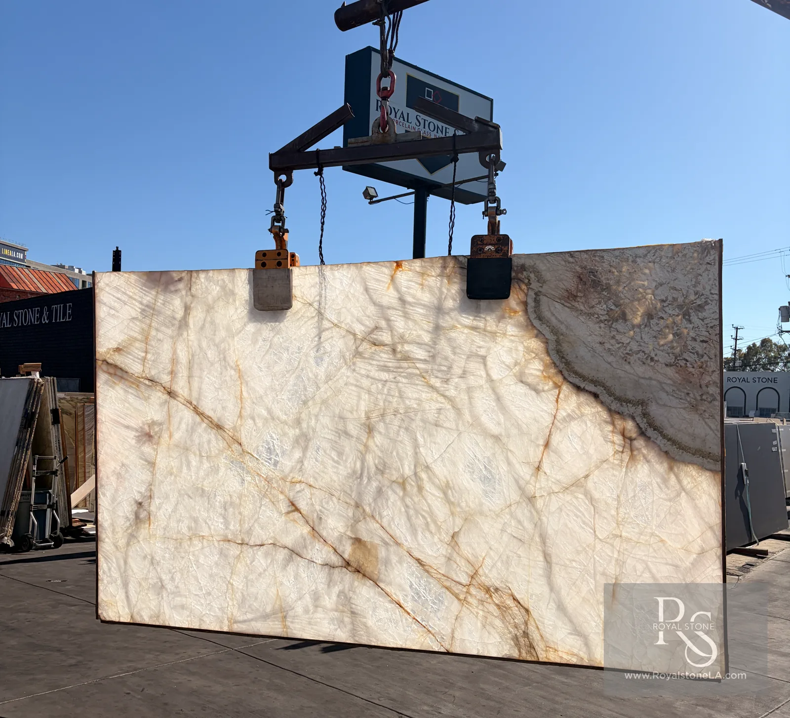 Backlit 2cm Antolini Patagonia Vitrum Cristallo AO177 polished quartzite slab at the Royal Stone yard, 77 by 130 inches