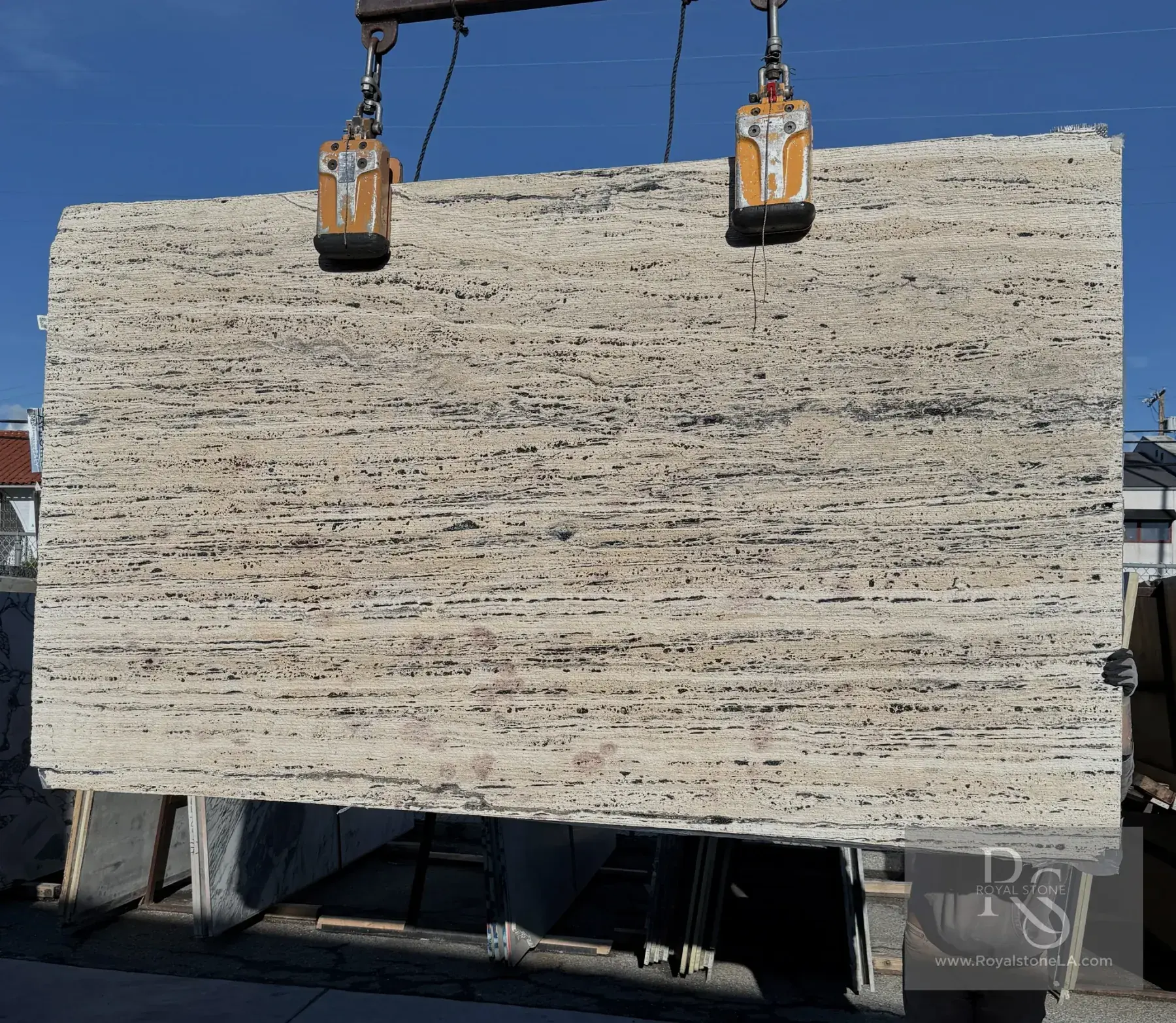2cm Antolini Black Label Travertino Platinum slab in Stratos textured finish at Royal Stone Los Angeles, bright ivory and cream stratification with delicate wavy bedding and fine linear surface relief, 69 by 119 inches