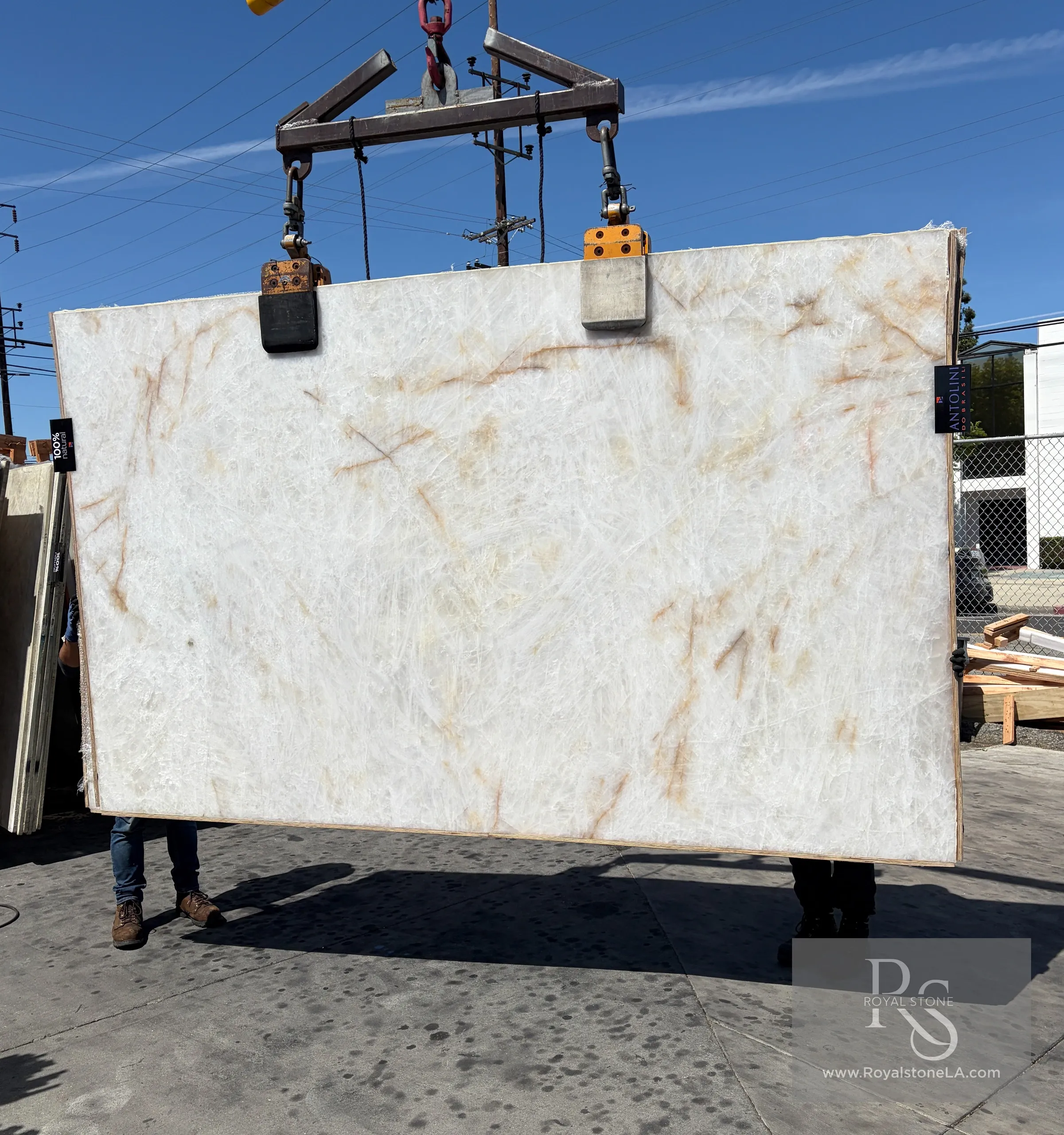 2cm Antolini Cristallo Bianco Selected quartzite slab with honed finish, showing light-reflective crystalline white surface with subtle amber and grey veining