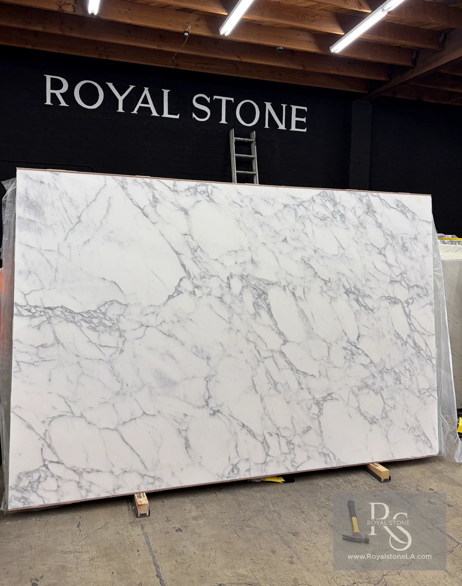 2cm Calacatta Borghini Extra Lot 15728 honed marble slab standing in the Royal Stone indoor warehouse in Los Angeles
