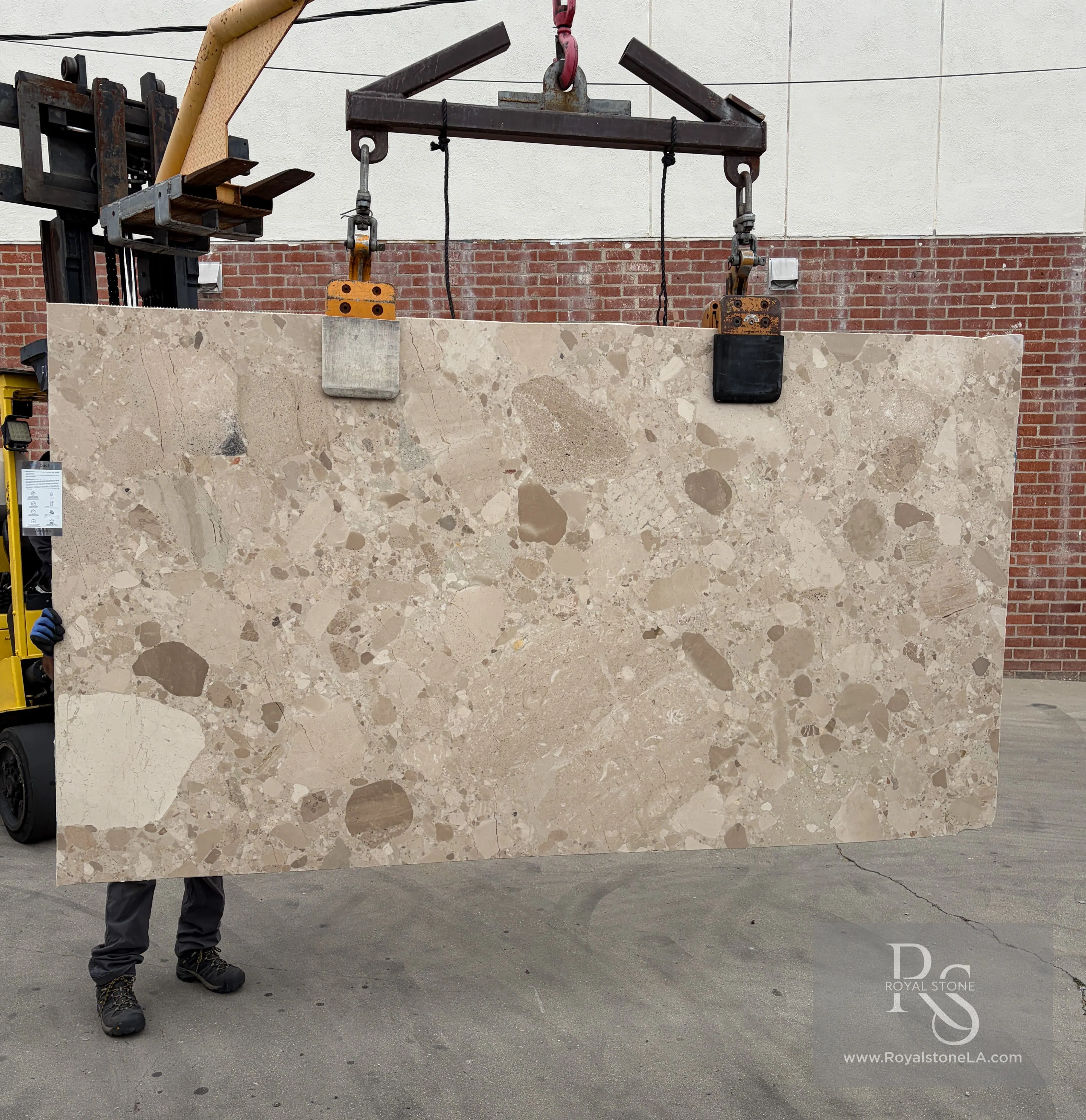 2cm Antolini Ceppo Beige Avorio EF299 marble slab, honed, 63 by 114 inches, suspended on a forklift at the Royal Stone yard