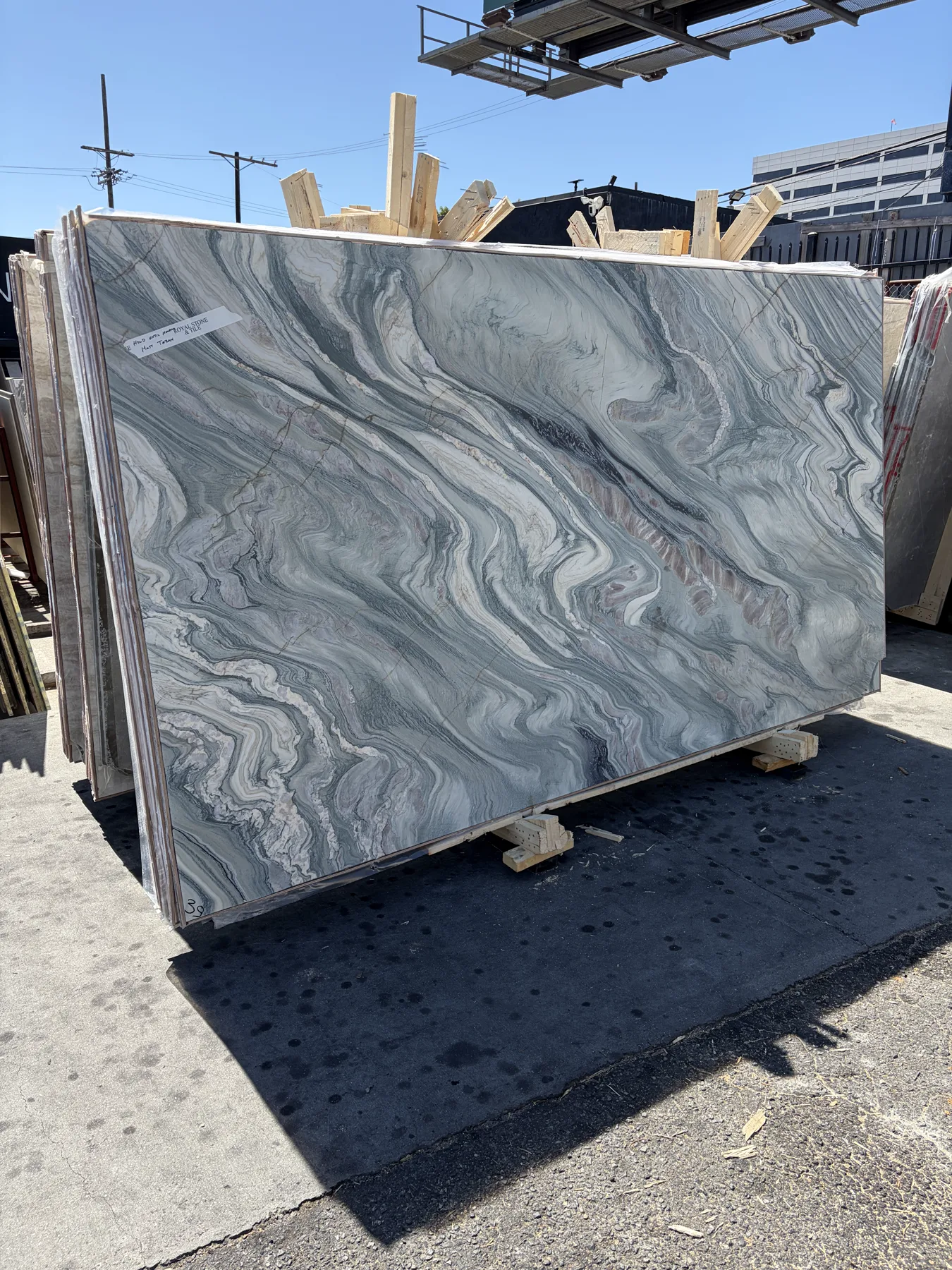Cipollino Verde Select Bassi 8707 honed marble slab standing in daylight at the Royal Stone yard in Los Angeles