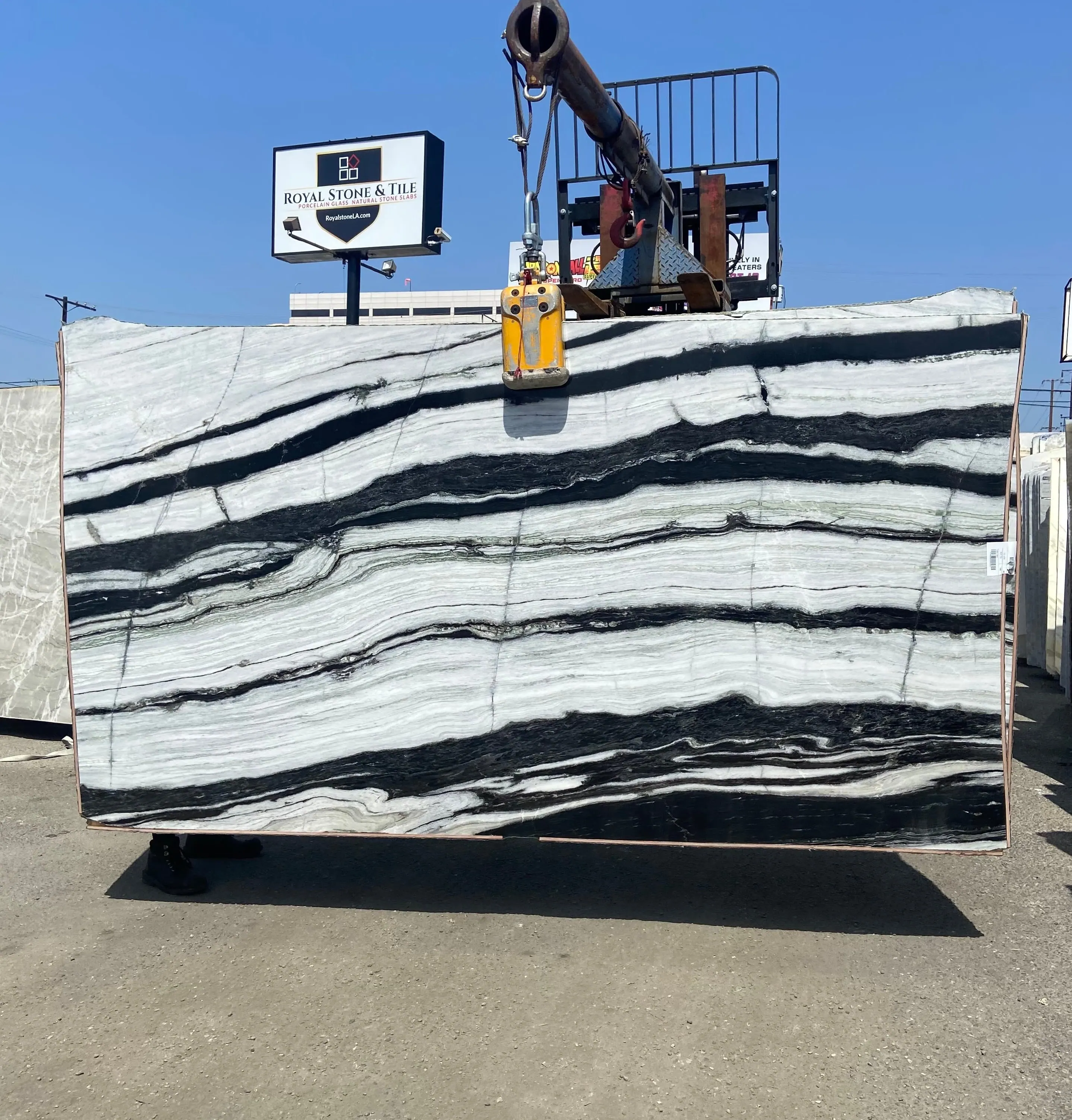Copacabana Panda quartzite polished slab with bold black and white horizontal banding at Royal Stone Los Angeles