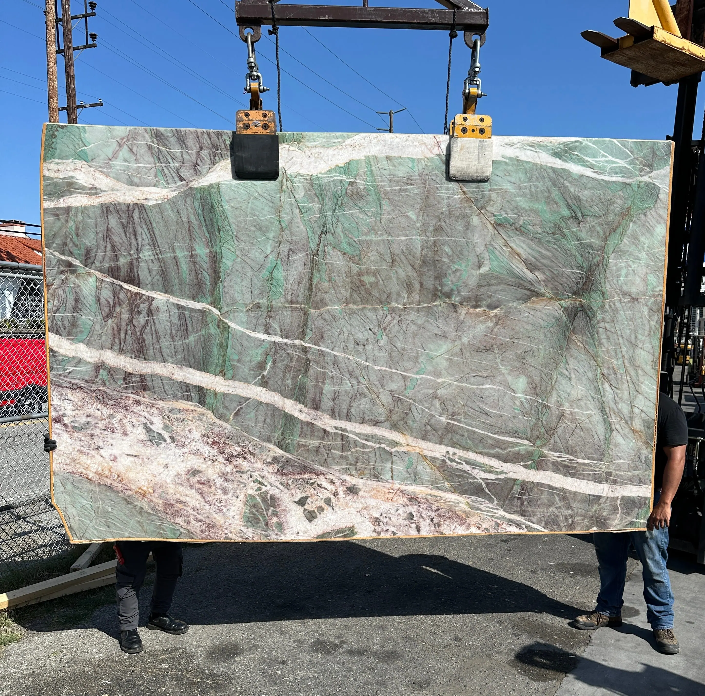 Cristallo Emerald Verde Patagonia Amazzonite quartzite slab on the crane, emerald and jade field with ivory crystal veining, polished finish