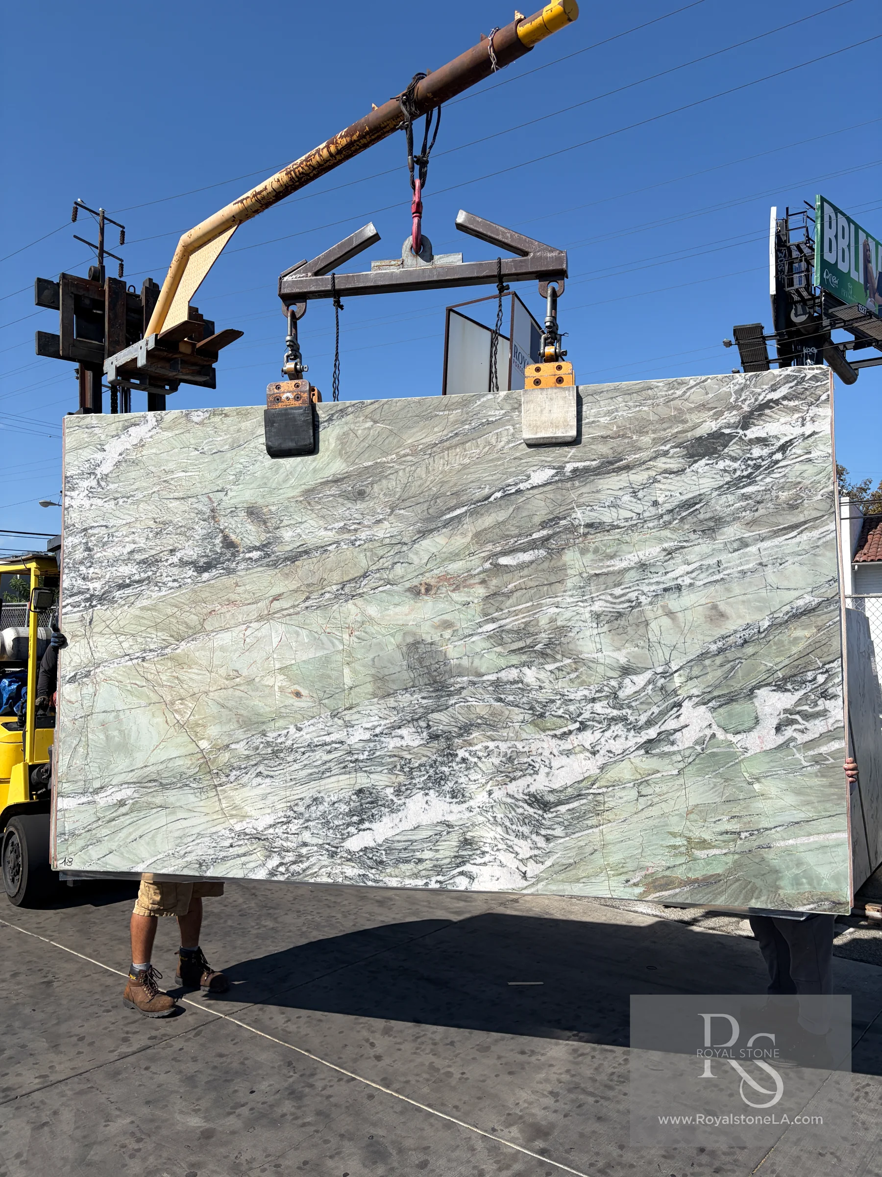 2cm Crystal Emerald Patagonia RCMAR58 honed quartzite slab, 78 by 127 inches, being lifted at the Royal Stone yard in Los Angeles