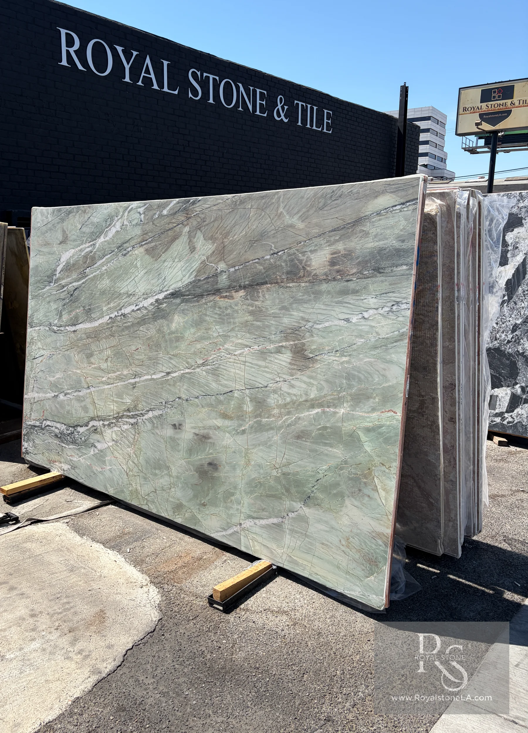 Emerald Green Patagonia Amazzoni honed quartzite slab BAS7783 on the Royal Stone yard floor in daylight, 78 by 126 inches