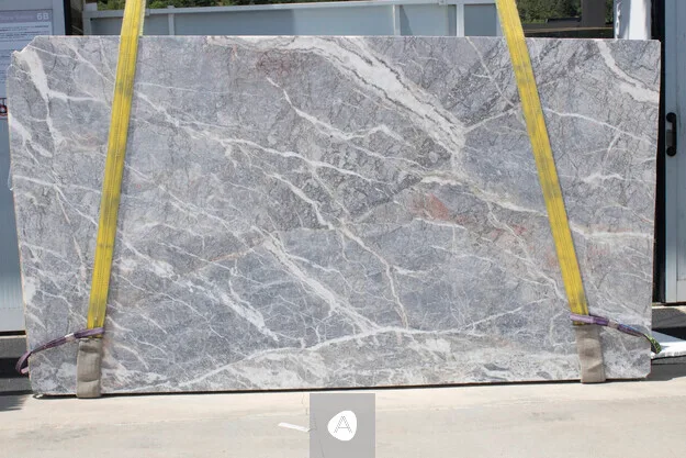Fior di Pesco Carnico marble slab with cool grey-blue field and white and rose veining, matt finish