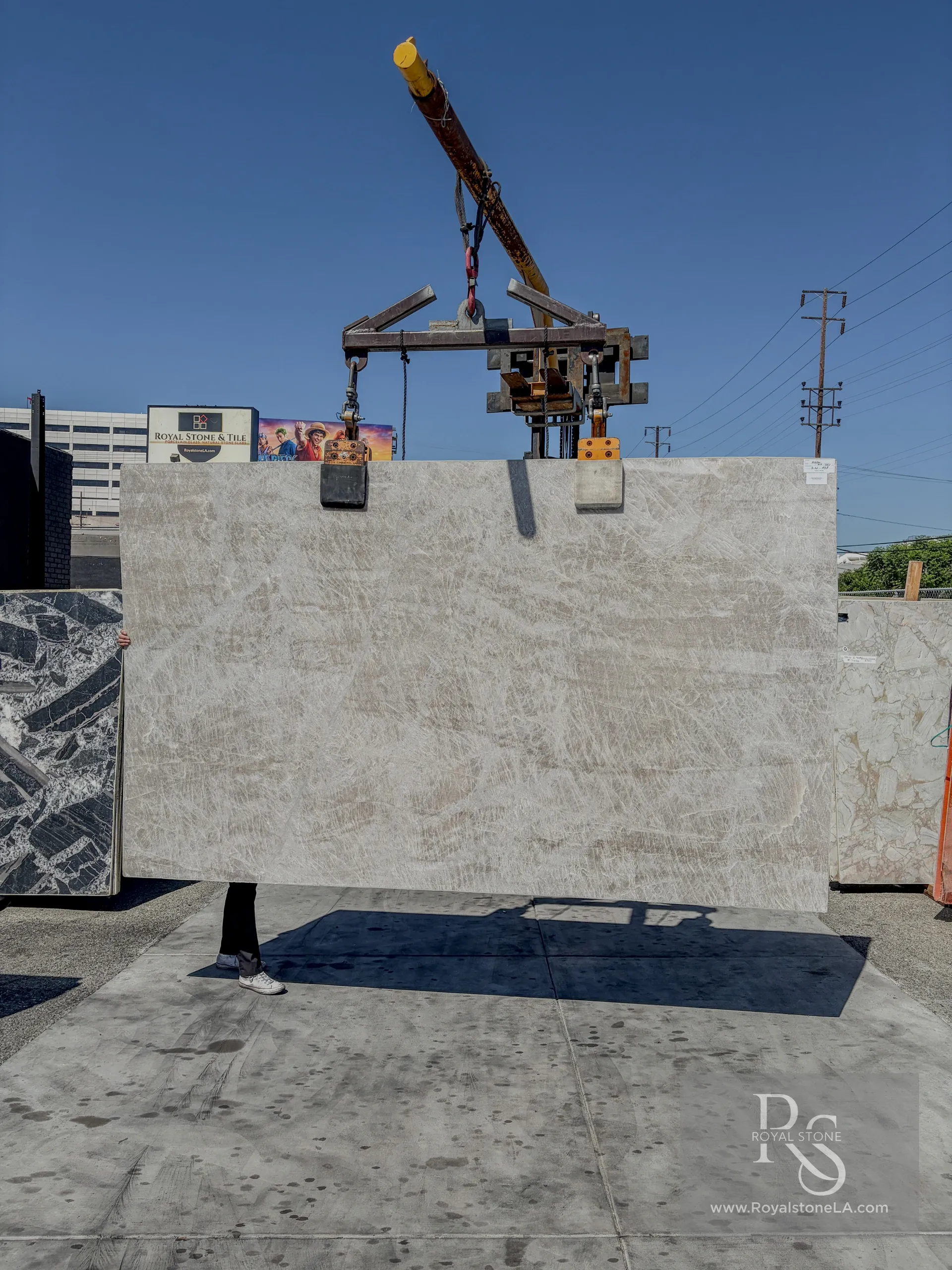 Large-format Taj Mahal Quartzite slab in warm honed finish, demonstrating the soft ivory and beige tones characteristic of the material