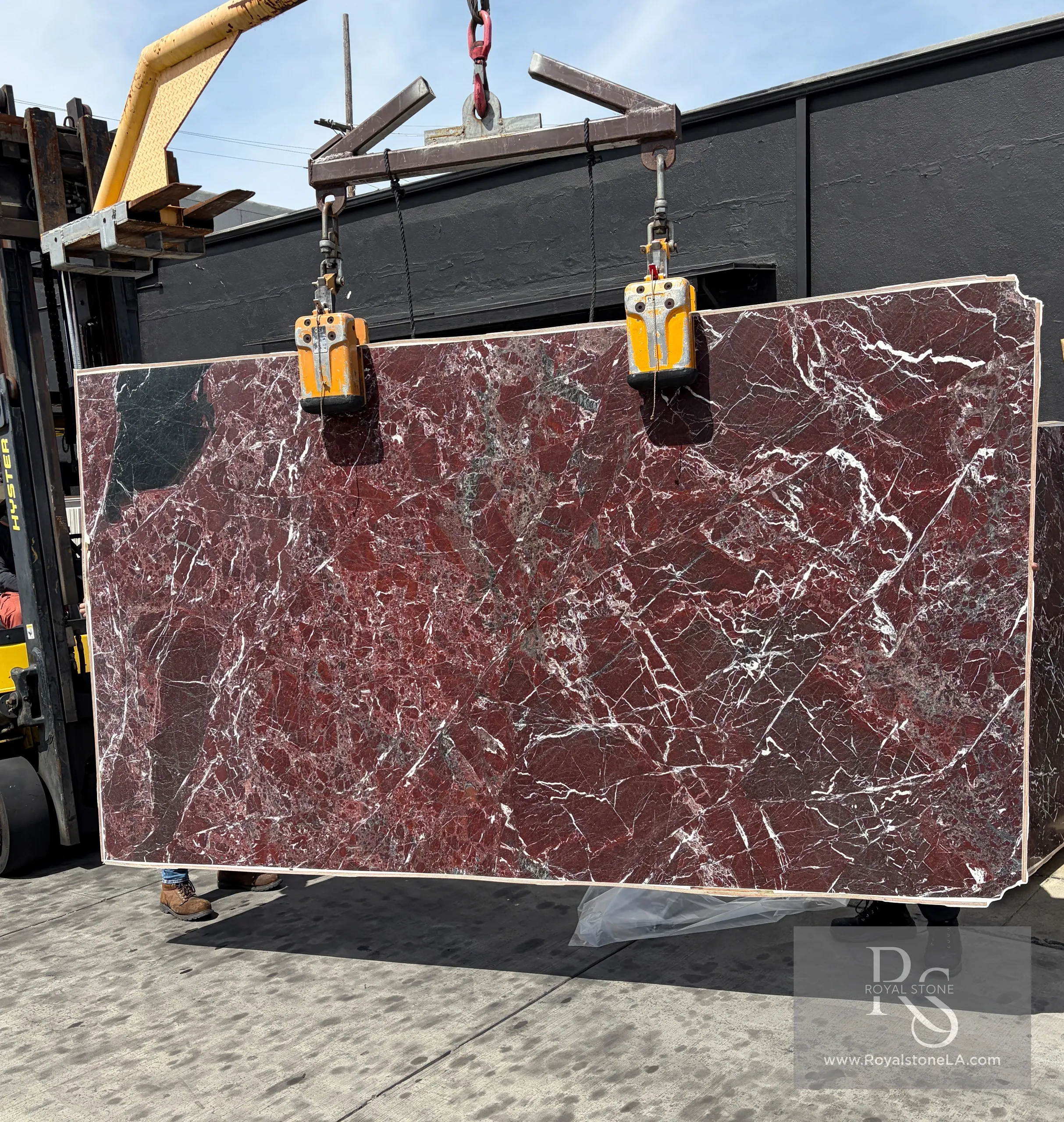 Rosso Lepanto marble slab with leathered finish, featuring warm burgundy and cream tones characteristic of Italian natural stone
