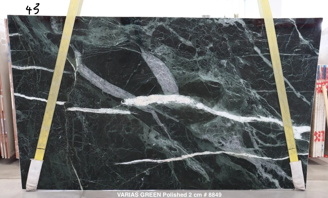 Varias Green marble slab with deep forest-green field broken by white quartz veining, polished