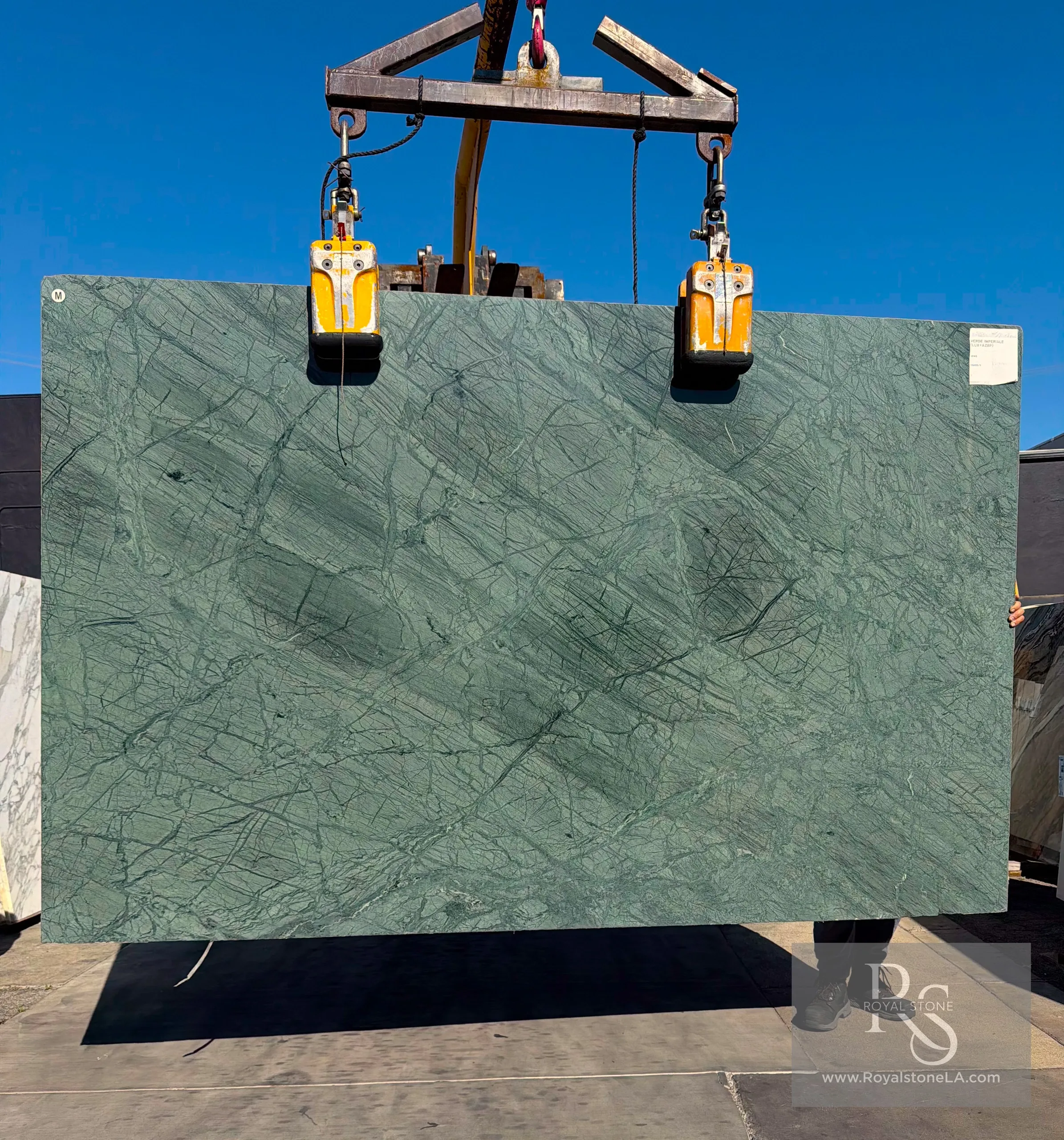 Antolini Verde Imperiale green marble slab with dark forest-green hue and intricate charcoal veining, polished finish