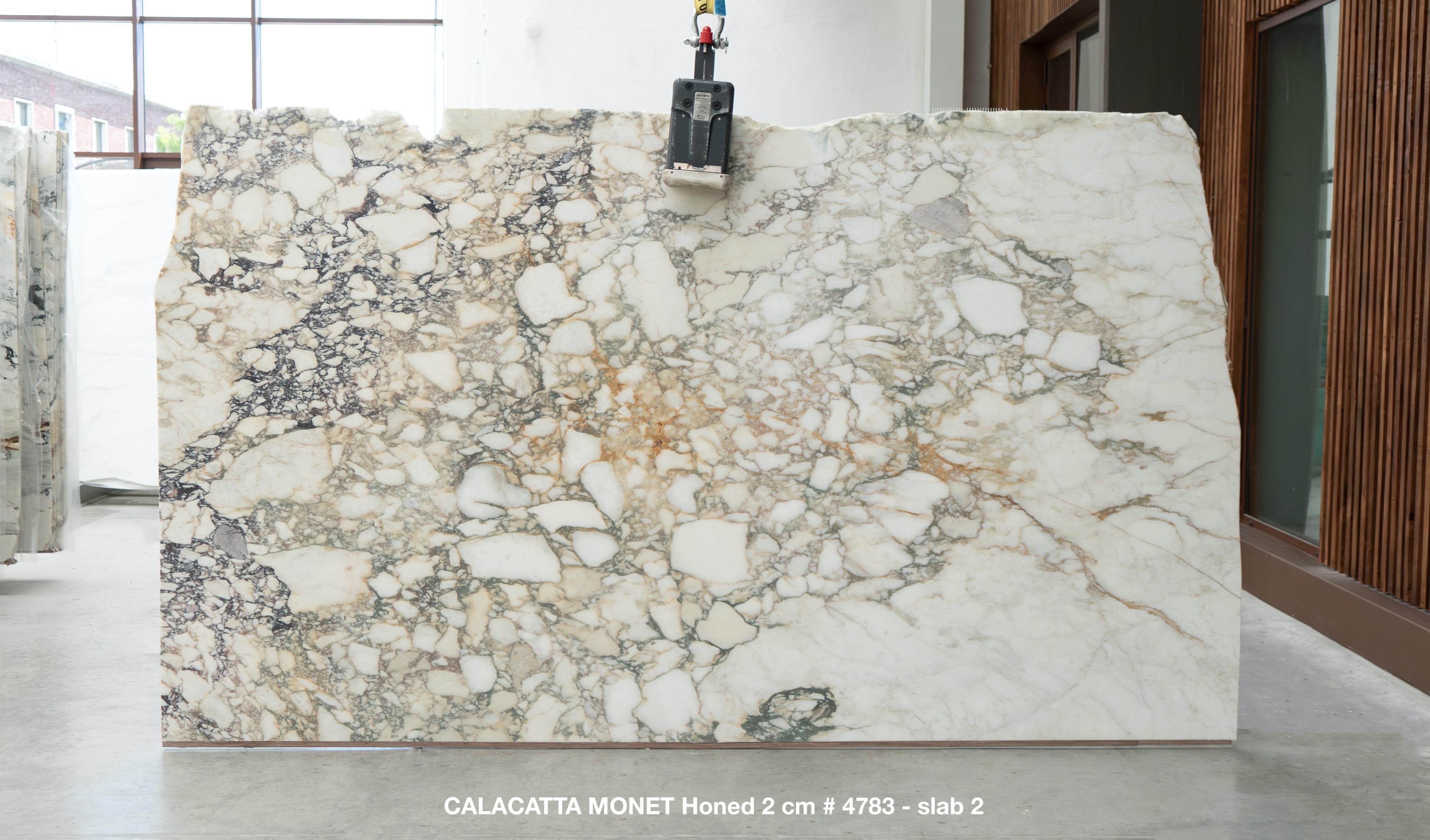 Calacatta Monet honed marble slab from lot 4783, 135 by 77 inches, displayed at the stone yard