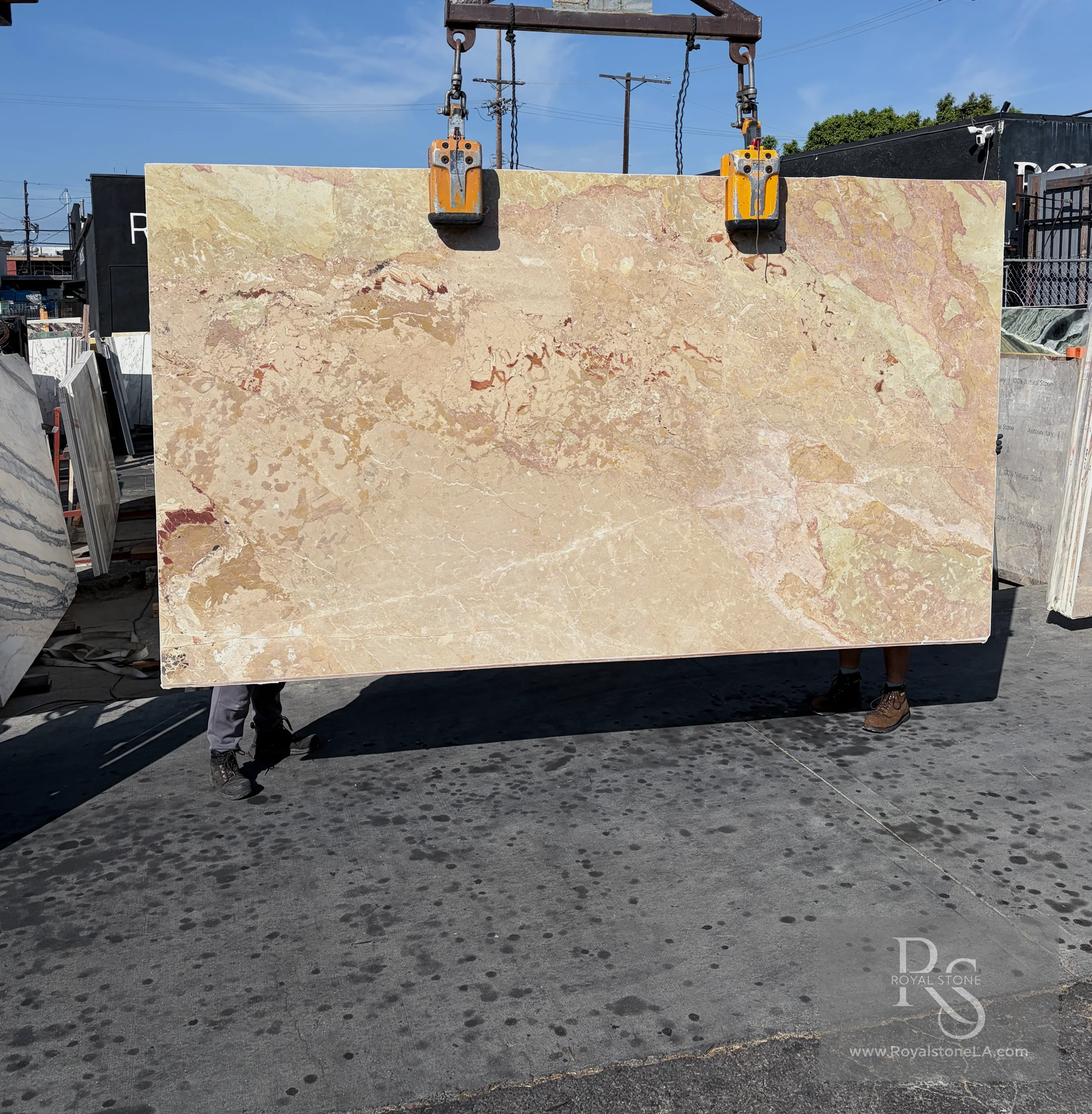 Ceppo Breccia Savoie BAS9048 honed marble slab held on the crane at the Royal Stone yard in Los Angeles