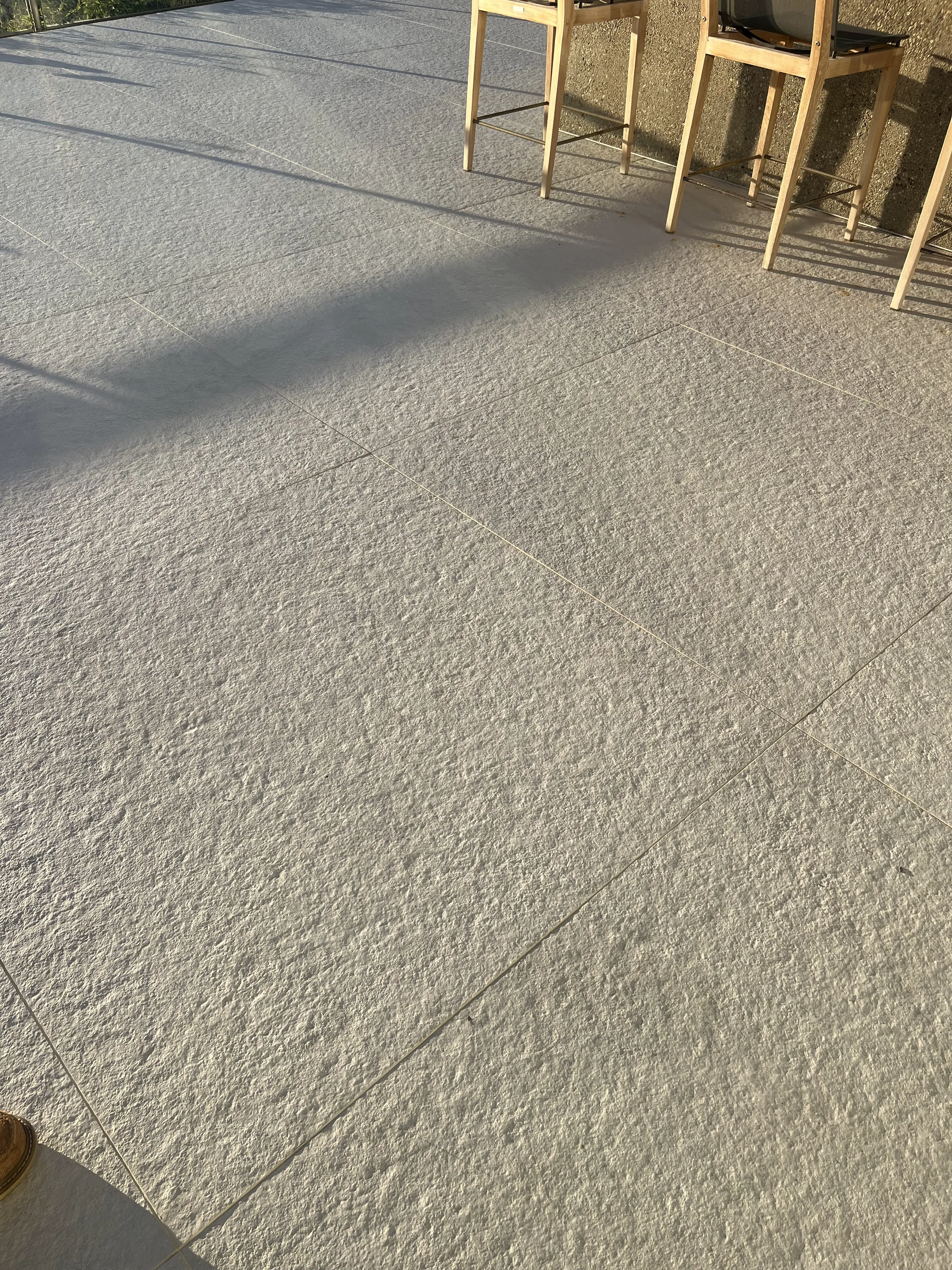 Refin River White Grey textured 48 by 48 large-format porcelain tile installed as a residential interior floor