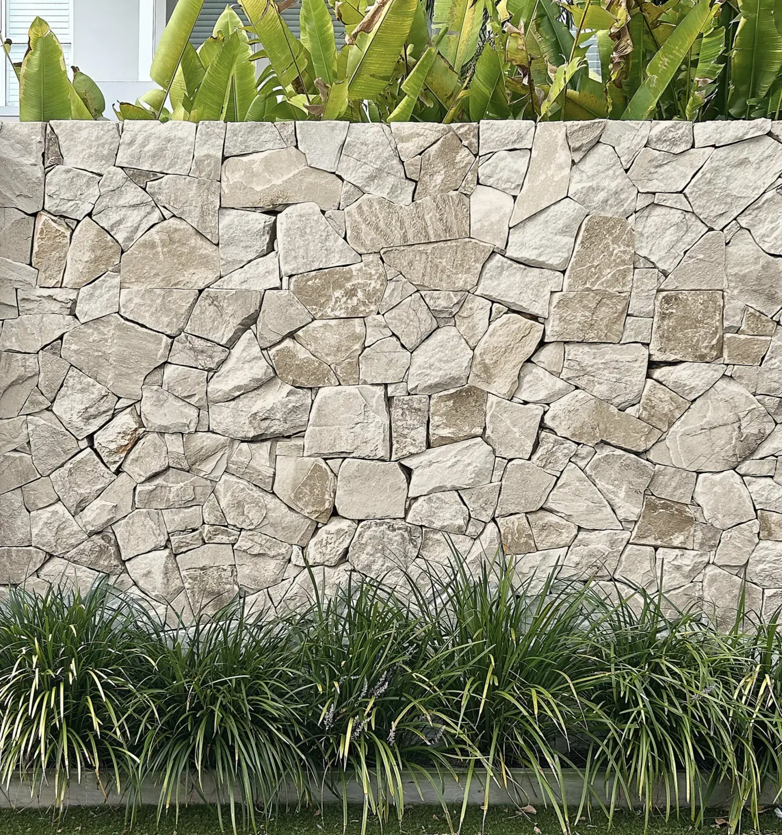 Ivory Premium Travertine thin veneer installed as an exterior feature wall