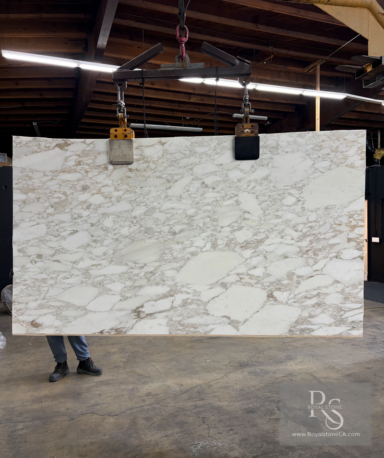 2cm Calacatta Vagli Gold Super Extra marble slab, MAN4826 honed finish, 72 by 124 inches, suspended at the Royal Stone yard for nationwide crating