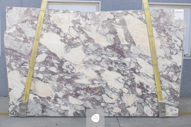 Calacatta Viola Antico Extra marble slab with warm cream ground laced with violet, plum, and amber breccia, polished