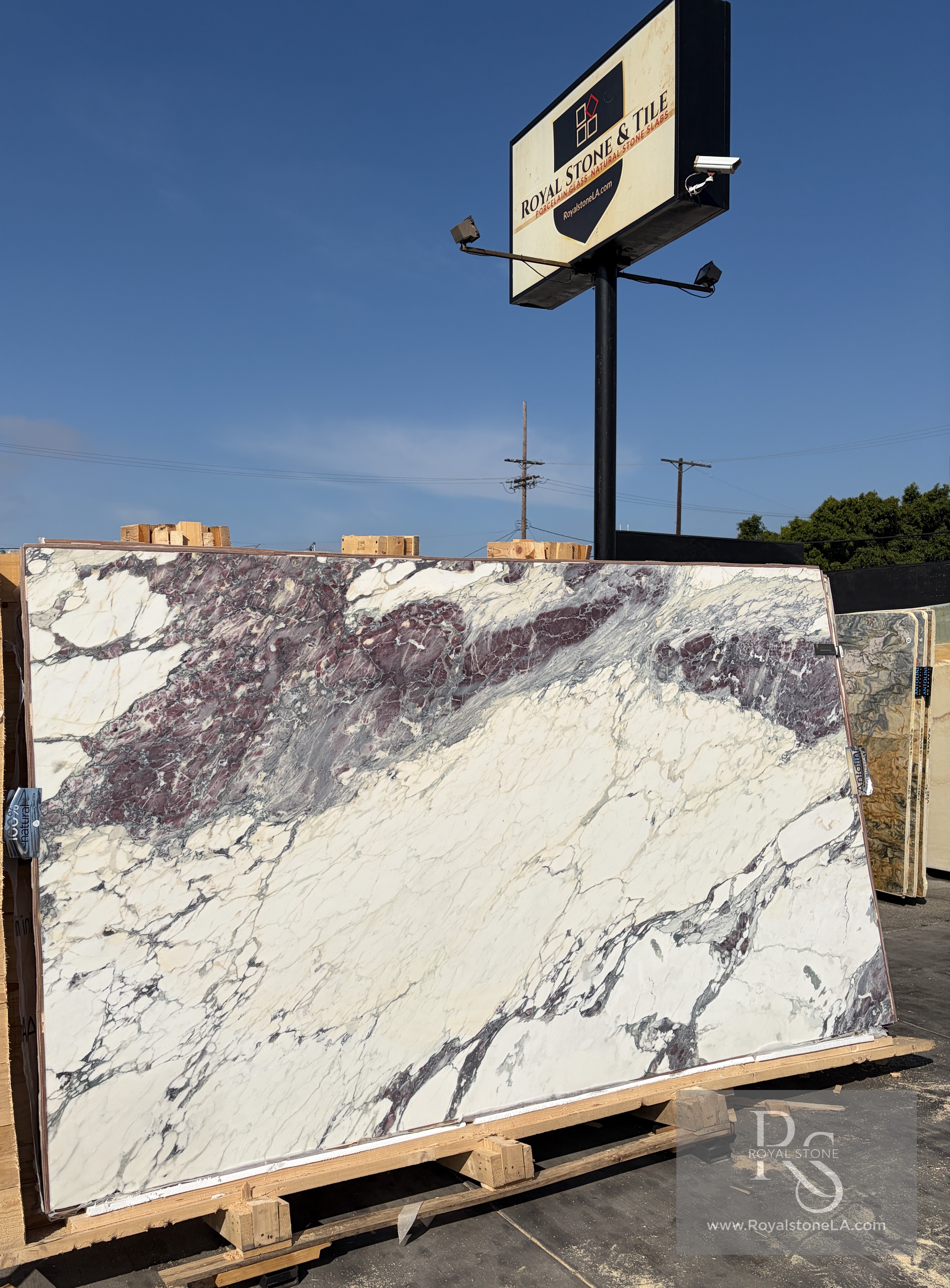 Antolini Breccia Capraia Ultimate YG557 honed marble slab at Royal Stone, white field with burgundy and violet brecciated veining
