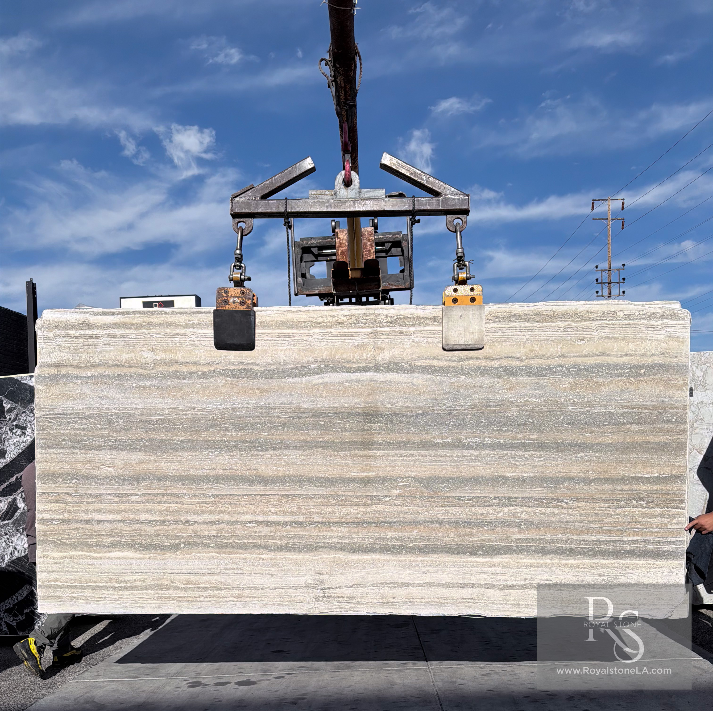 Henraux silver travertine Ocean Blue filled vein-cut slab at Royal Stone Los Angeles