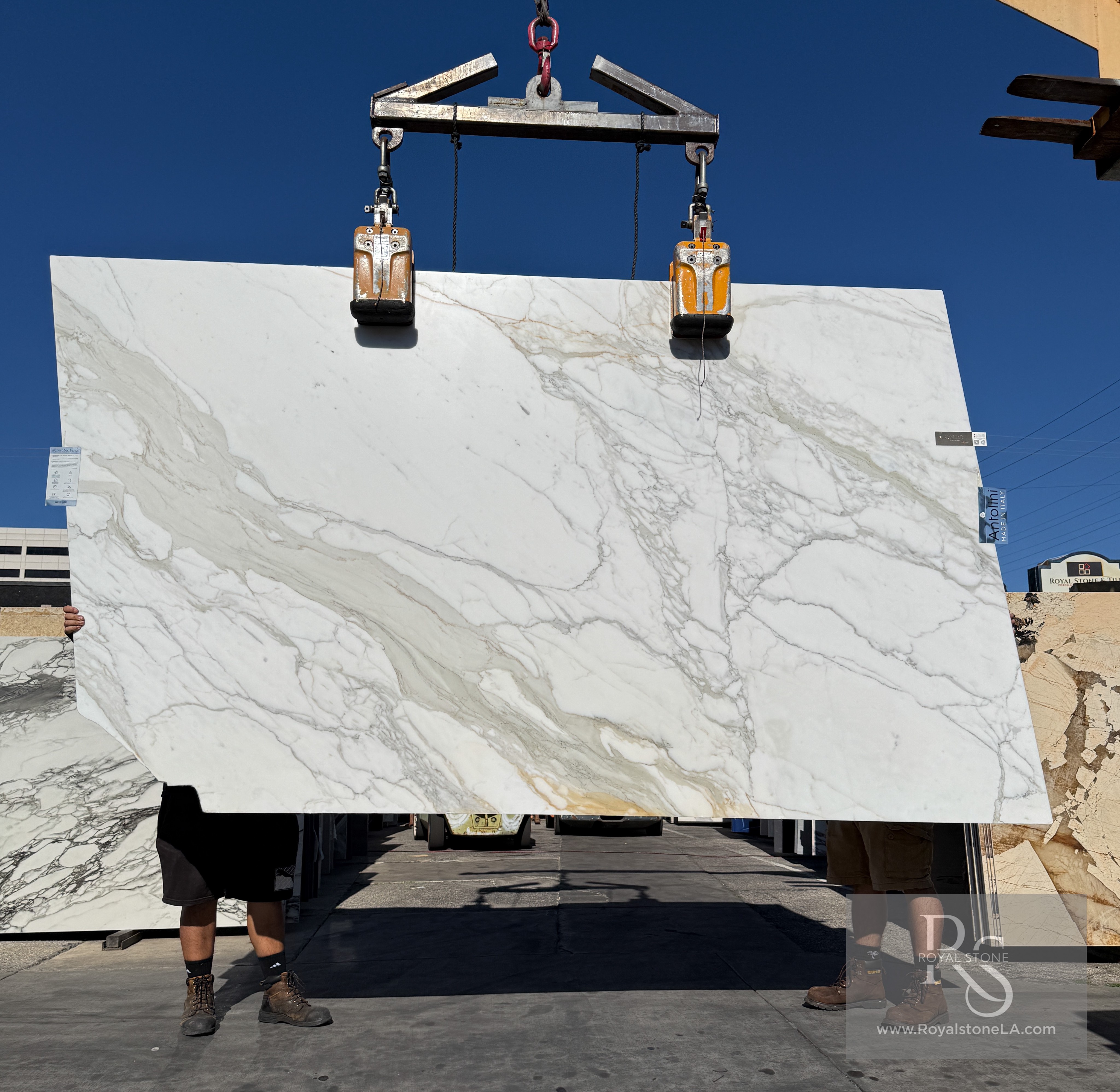 Antolini Borghini Calacatta Gold honed marble slab at Royal Stone, white field with thick painterly gold veining