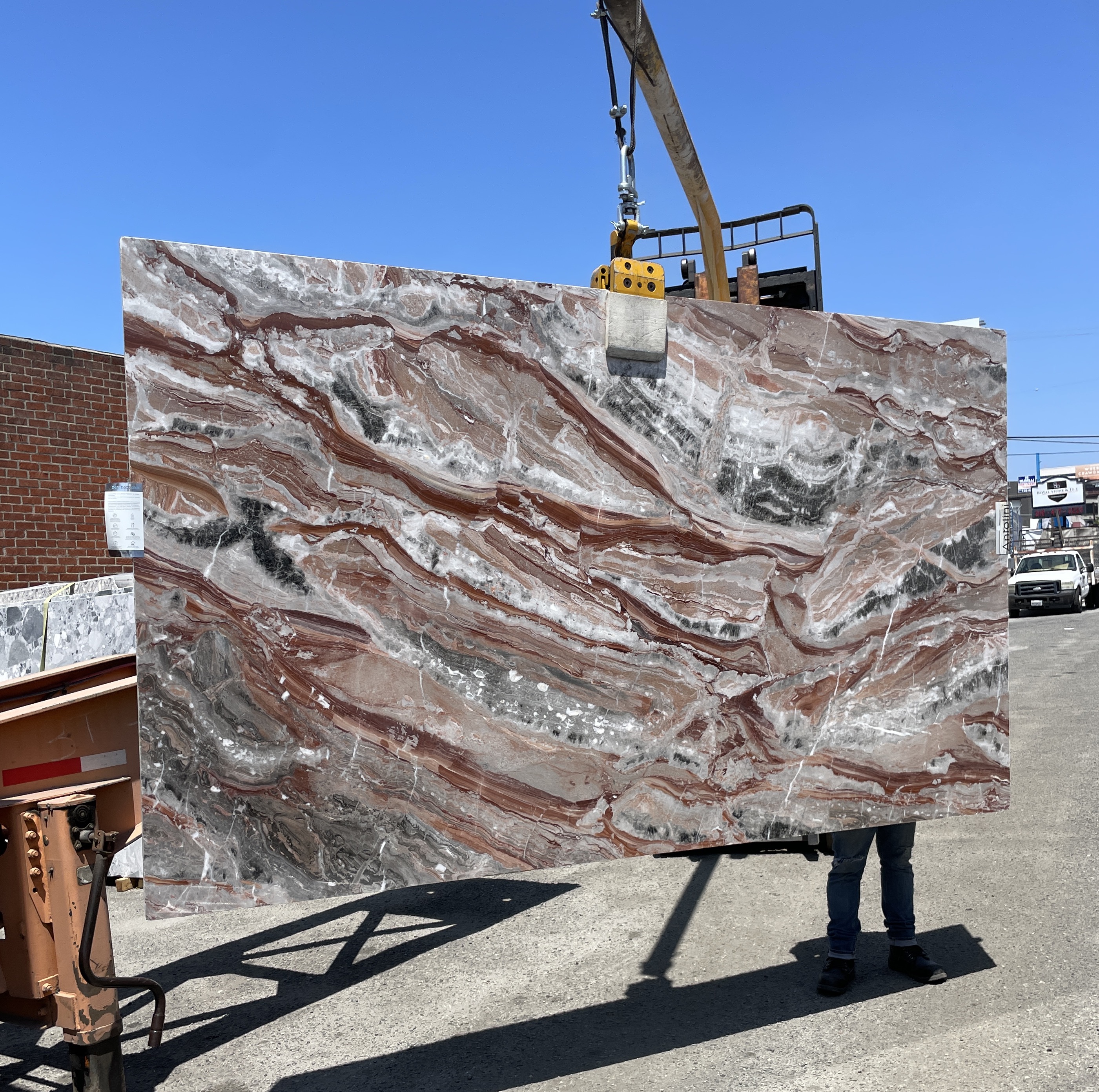 Antolini Viola Orobico polished Italian marble slab at Royal Stone Los Angeles — rust-red, plum and silver-gray currents