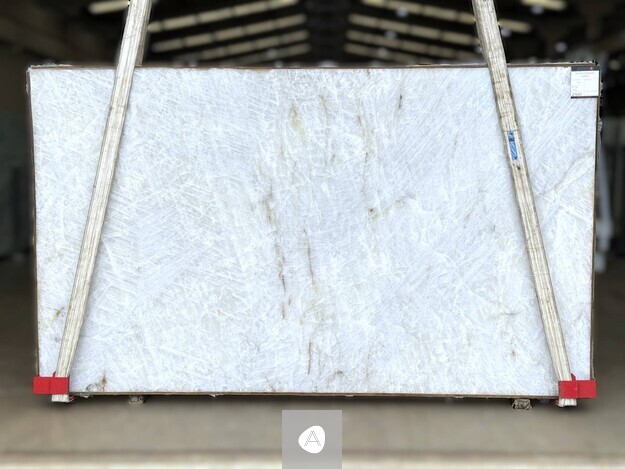 Antolini Cristallo Traslux Classic quartzite slab with near-clear white field and minimal veining, polished