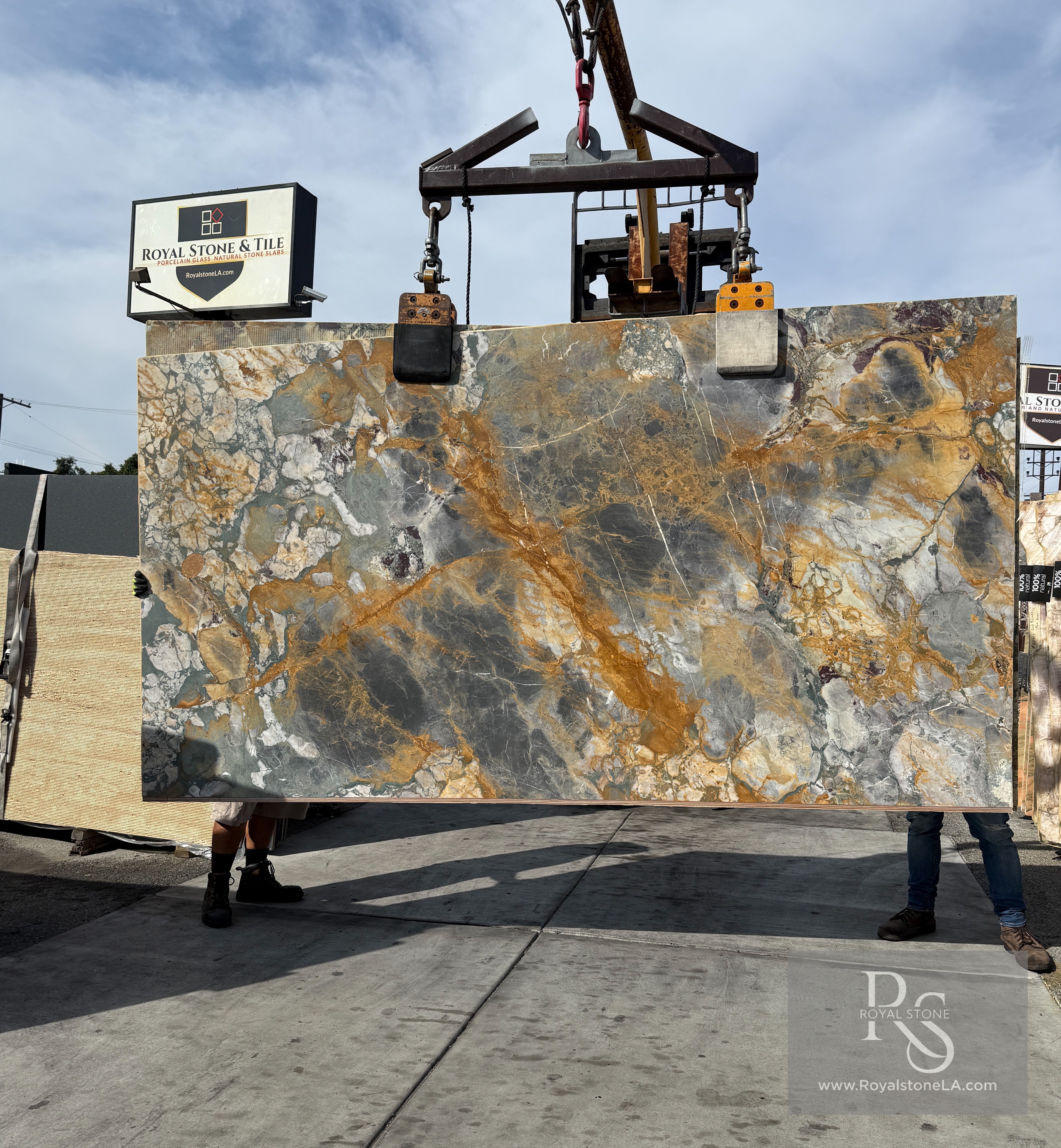 Antolini Brèche de Vendôme honed marble slab at Royal Stone, dark gray field with golden amber veining