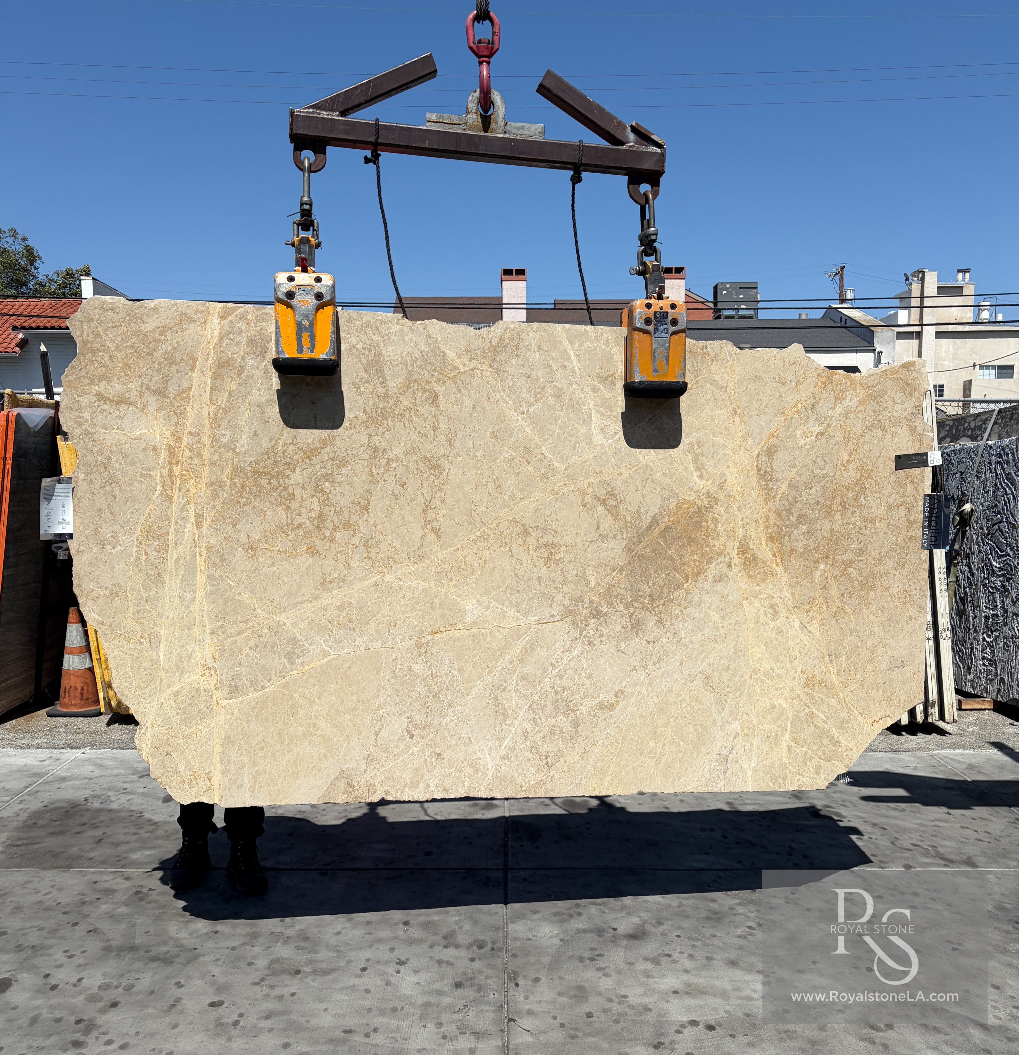 Antolini Emperador Light honed marble slab at Royal Stone, creamy beige field with soft taupe veining