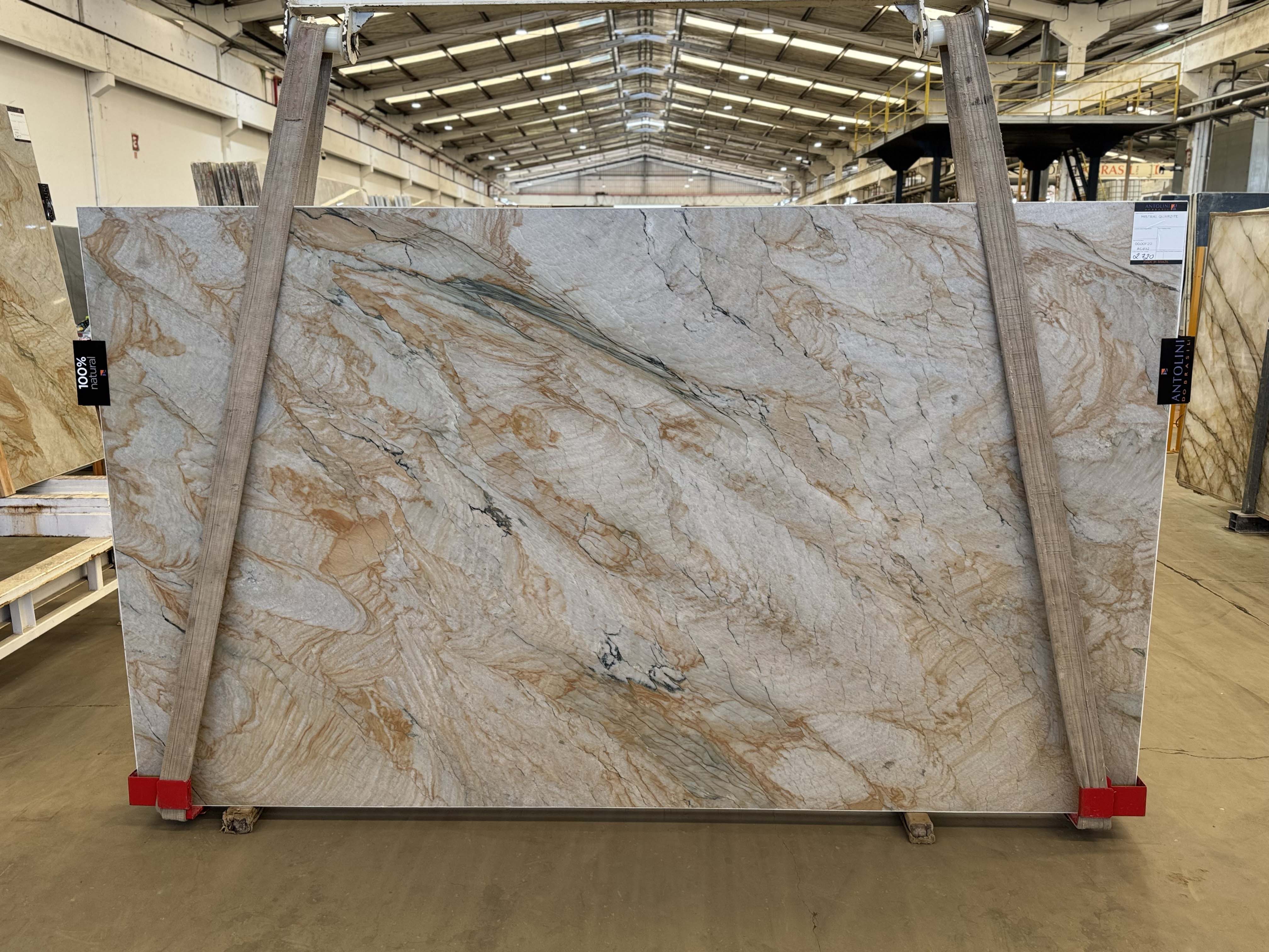 Antolini Mistral Warm honed quartzite slab at Royal Stone, ivory and beige field with taupe and caramel veining