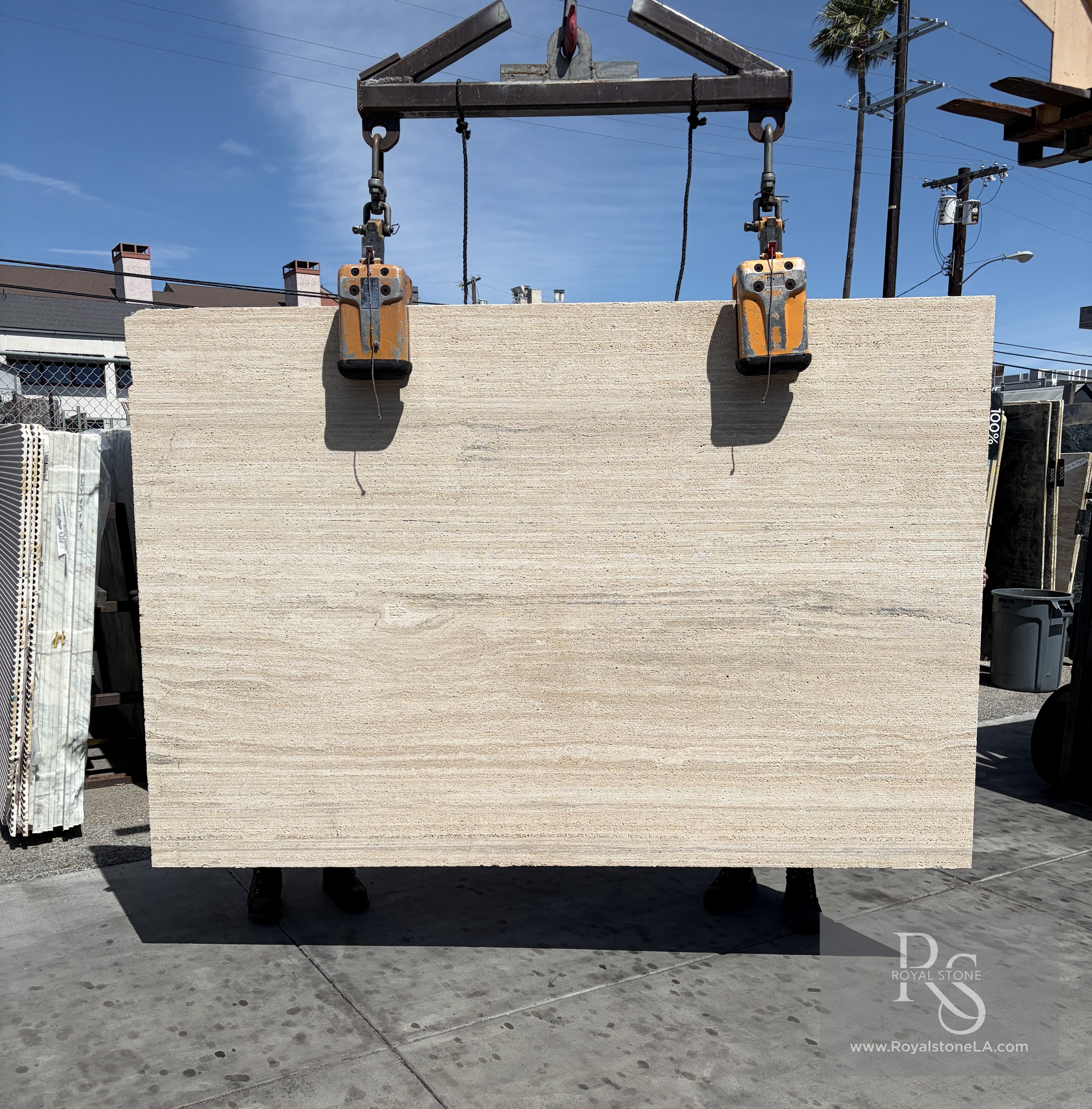 Antolini Travertino Classico Light Stratos finish slab at Royal Stone, vein-cut ivory and cream travertine with textured linear surface