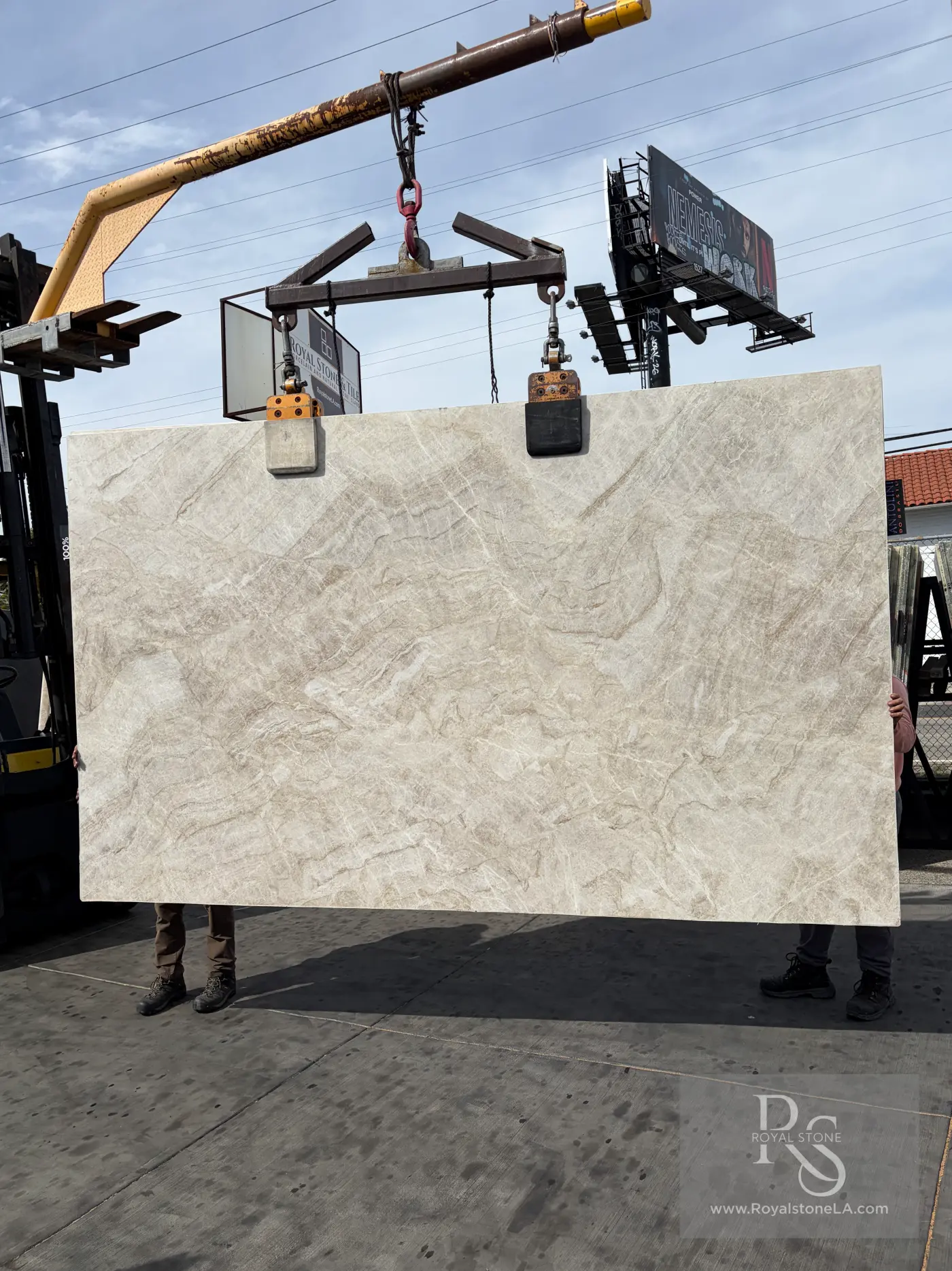 Taj Mahal Select honed quartzite slab at Royal Stone, warm ivory field with low fawn drift, 78 by 130 inches