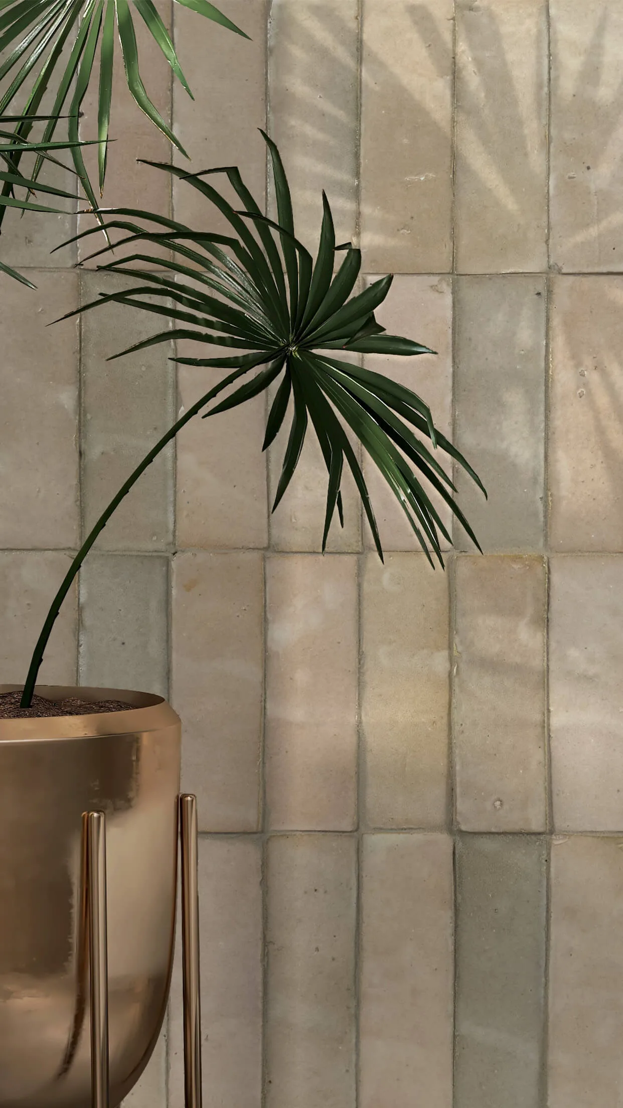 Zellige Classique tile lifestyle shot with a brass planter on a tabletop, soft natural light